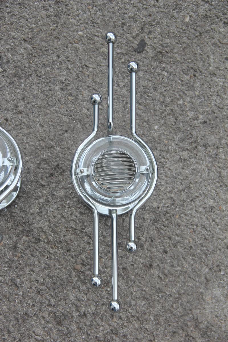Pair of steel Italian sconces sculptural form glass lens 1970 Stilkronen.
1 lamp bulb max 40 watt.