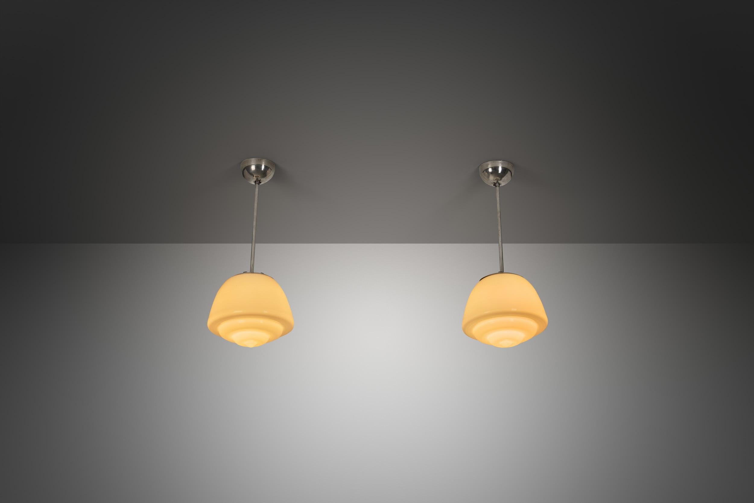 European Pair of Stepped Opal Glass Pendant Lamps with Metal Frame, Europe 1940s For Sale
