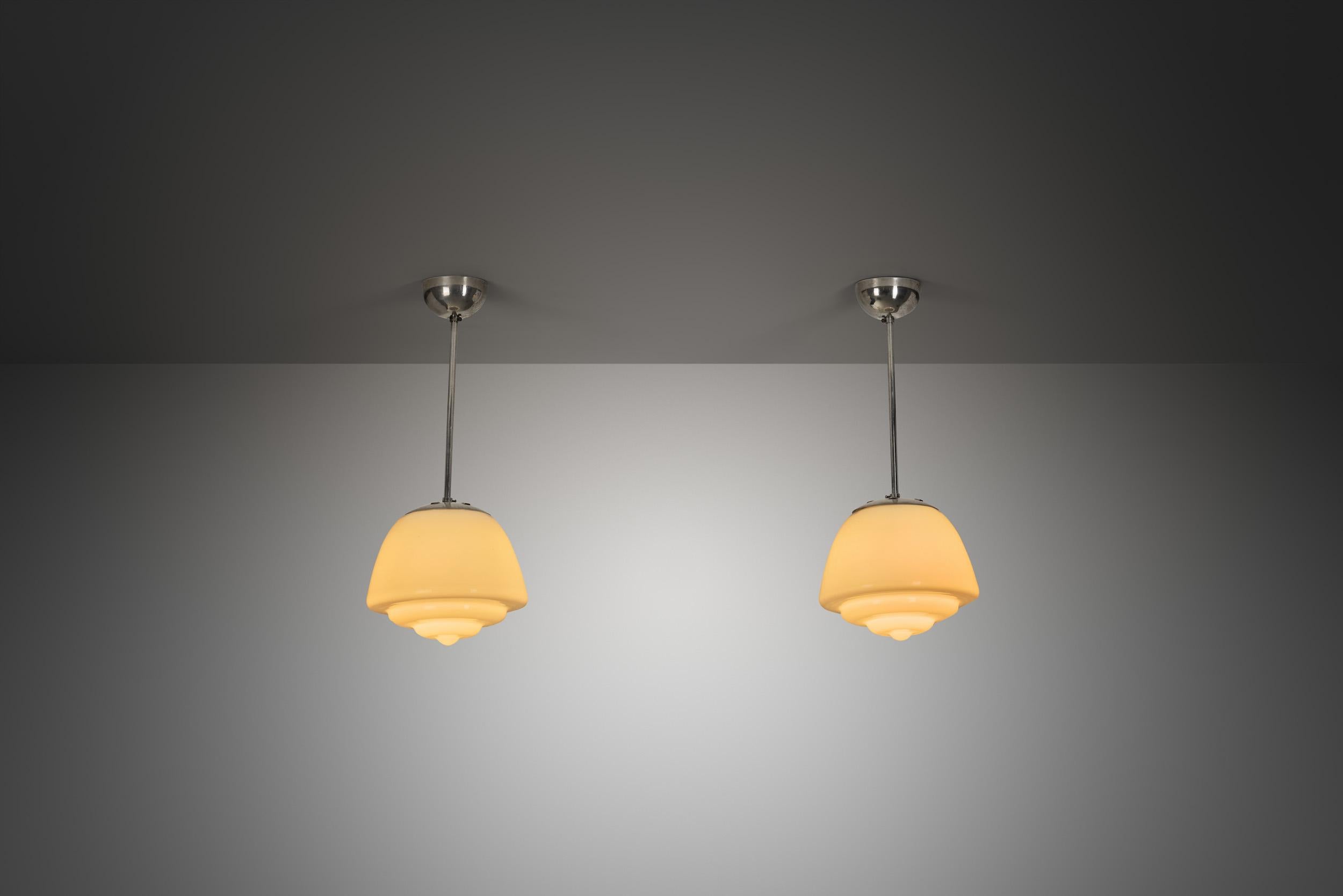 Mid-20th Century Pair of Stepped Opal Glass Pendant Lamps with Metal Frame, Europe 1940s For Sale