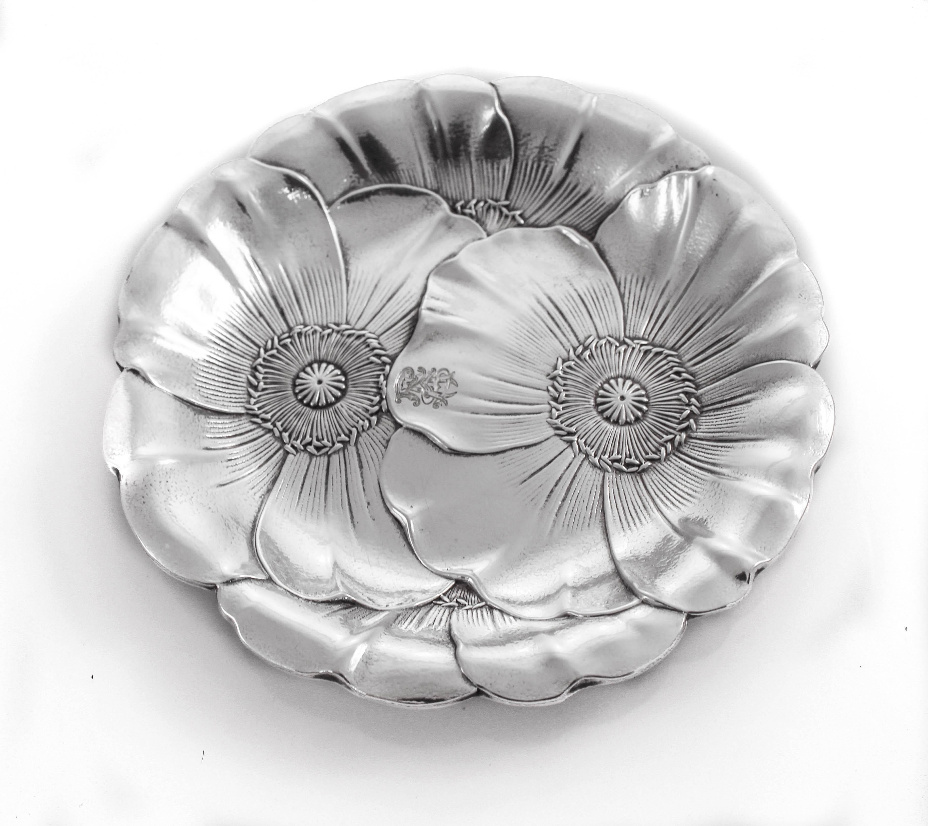 A rare set of sterling Art Nouveau dishes by Wallace Silversmiths. The Art Nouveau style was inspired by natural forms and structures, particularly the curved lines of plants and flowers. This pair of dishes are a perfect example of that style. They