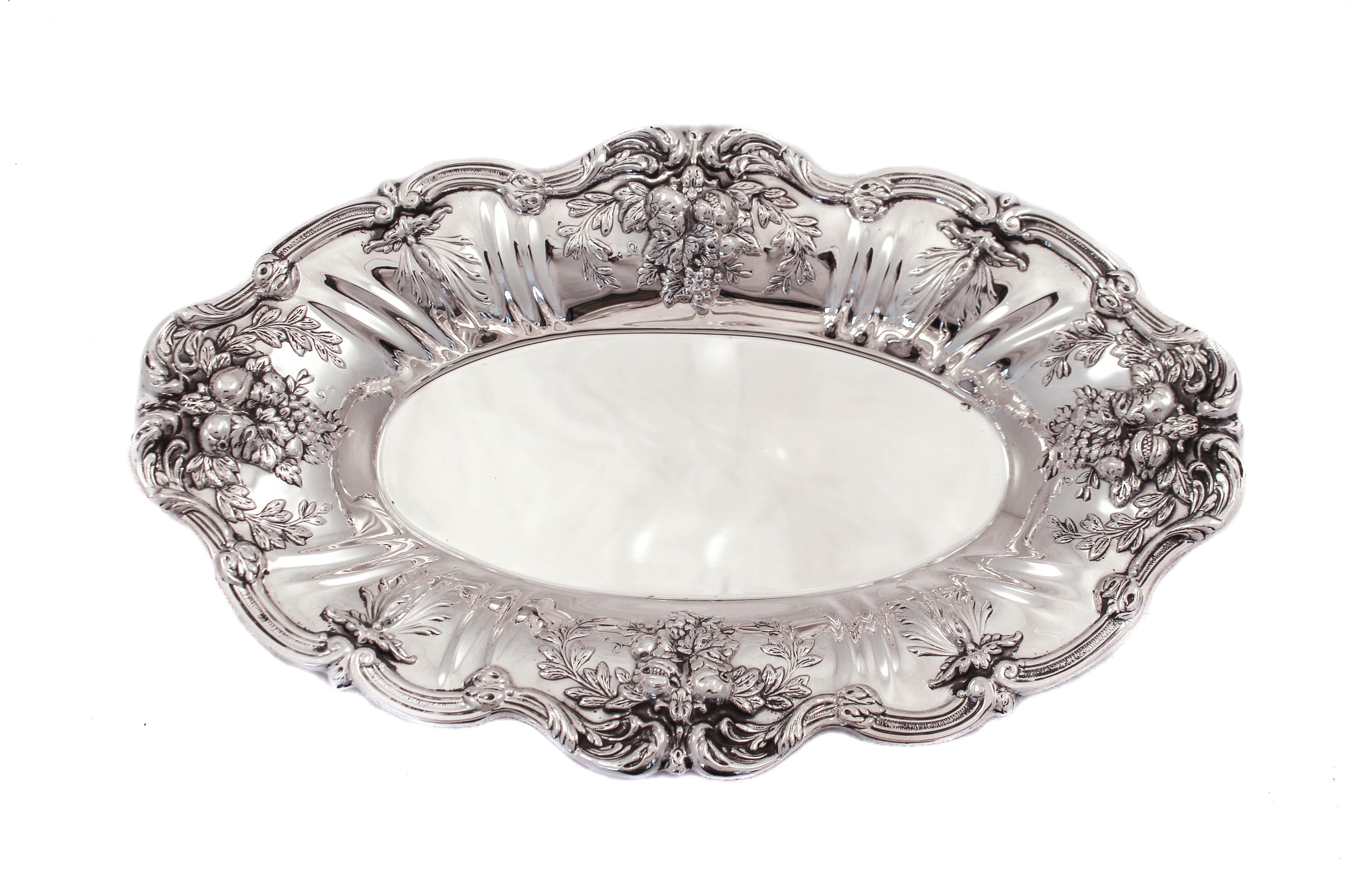 The Francis I pattern by Reed and Barton is the companies most iconic design. World famous and still highly sought after until today, and for good reason. Clusters of fruit and flowers drape the edges. A scalloped rim with four wreaths add to its