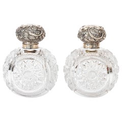 Pair of Sterling Silver and Cut Glass Cologne Bottles