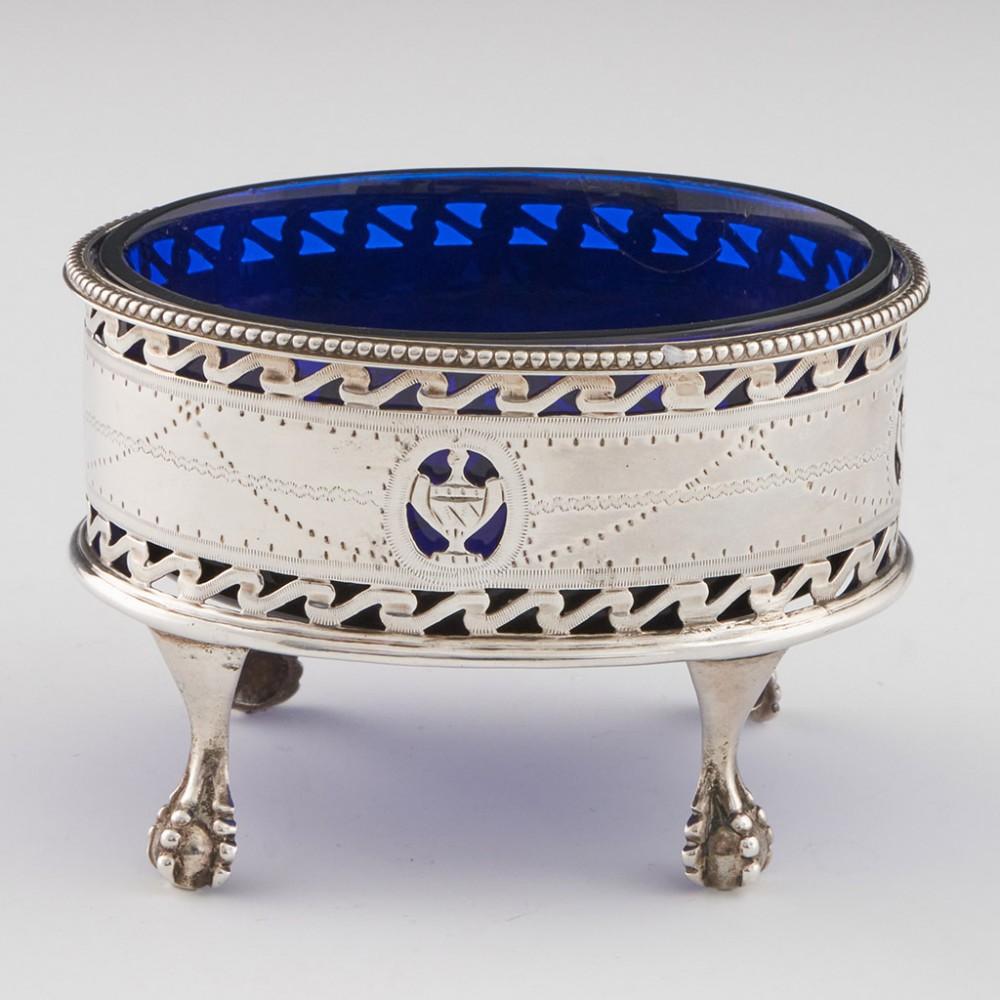 Heading : Pair of sterling silver and glass salts
Date : Hallmarked in London in 1783 for James Waters
Period : George III
Origin : London, England
Decoration : Beaded rims with tooled decoration bellow including urns with pierced outlines and