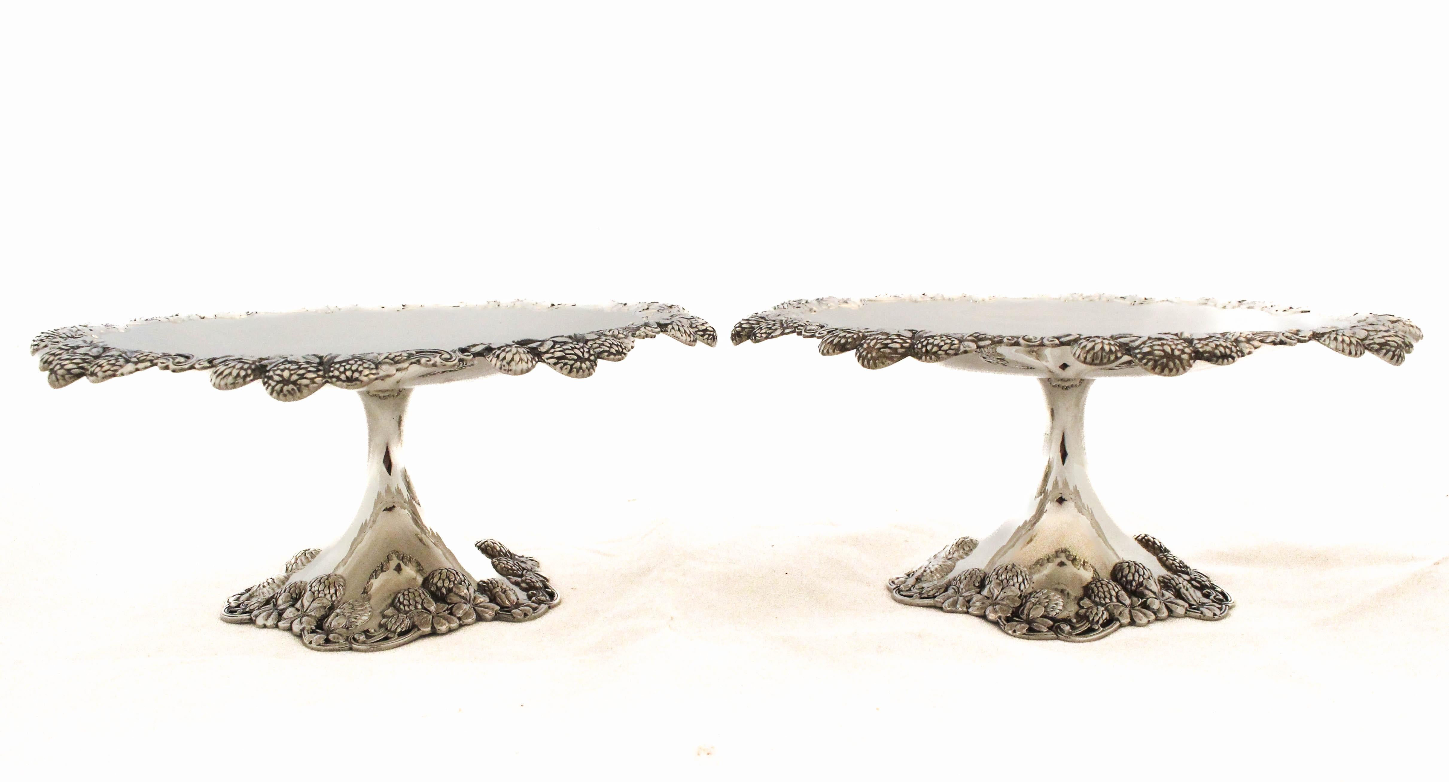 A breathtaking pair of sterling silver Art Nouveau compotes by Tiffany & Company, embodying the fluid elegance and botanical inspiration characteristic of the late nineteenth century. These extraordinary pieces feature a wide, shallow bowl elevated