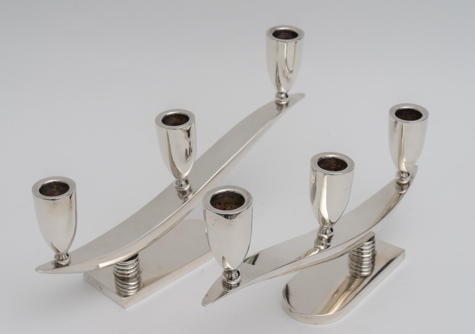 This stylish Moderne, Art Deco set of sterling silver candleholders are very much in the style of pieces created by Georg Jensen in the early 20th century. This set is by the firm MRN of Mexico.

Note: Makers mark on the Verso of the pieces (see