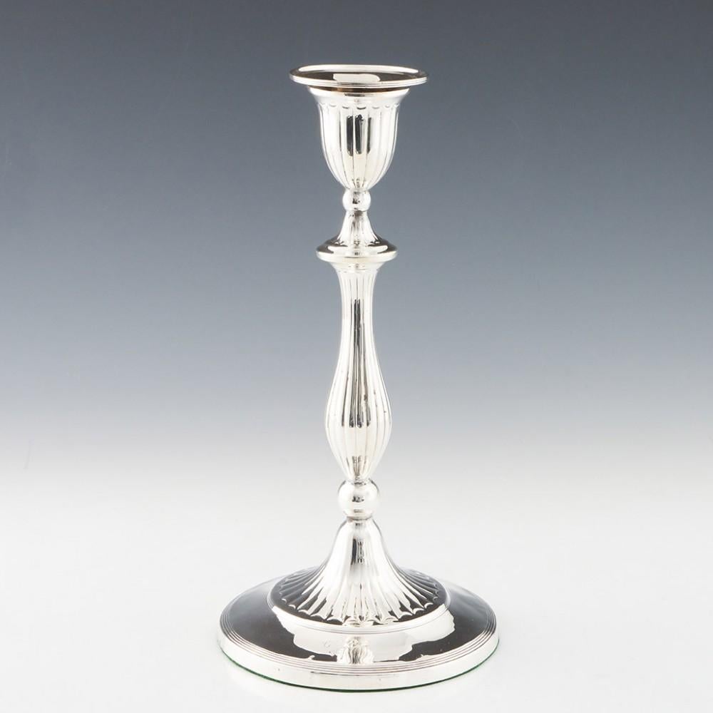 Heading : Pair of sterling silver candlesticsk
Date : Hallmarked in Sheffield in 1793 for John Parsons & Co
Period : George III
Origin : Sheffield, England
Decoration : Reeded baluster stems with ball knop cushion and blade knop collars. Reeded