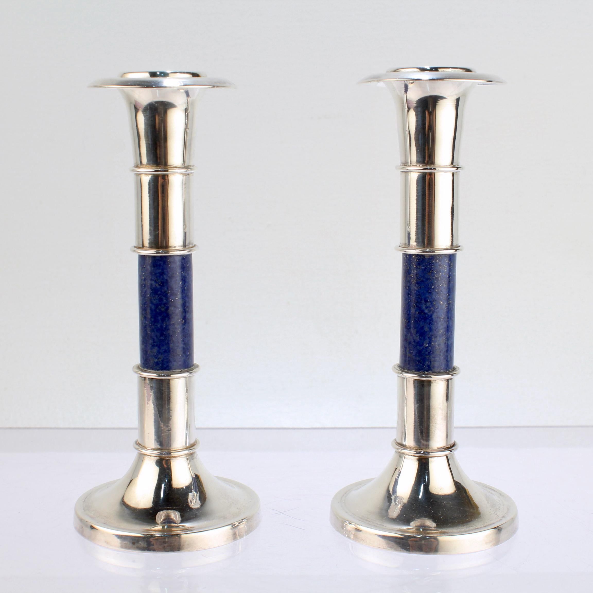 A fine pair of modern candlesticks.

Comprised of sterling silver and lapis lazuli. 

Simply wonderful candlesticks!

Date:
20th Century

Overall Condition:
It is in overall good, as-pictured, used estate condition. There are a few slight bends and