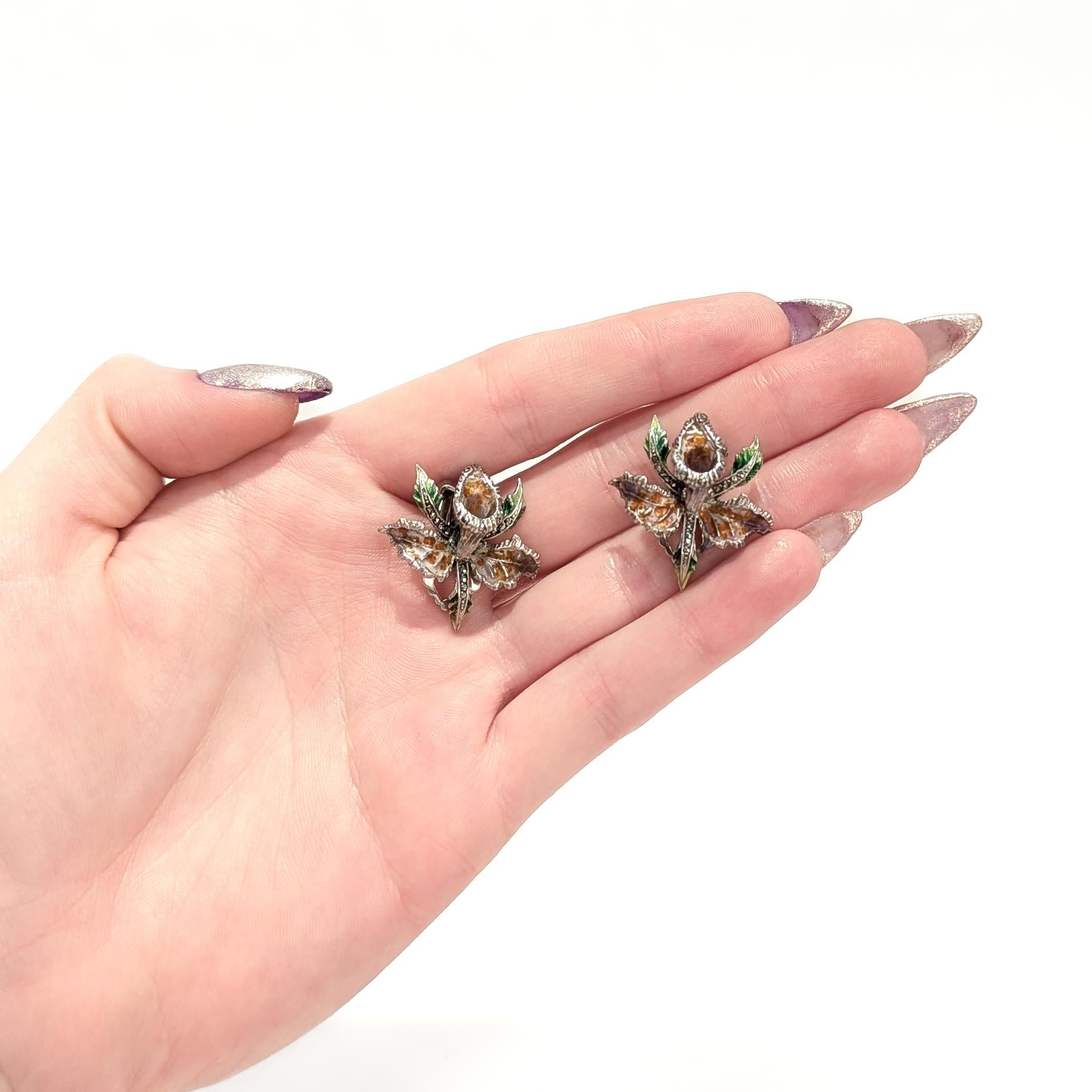 Round Cut Pair of Sterling Silver, Marcasite, & Enamel Cattleya Orchid Clip-On Earrings For Sale