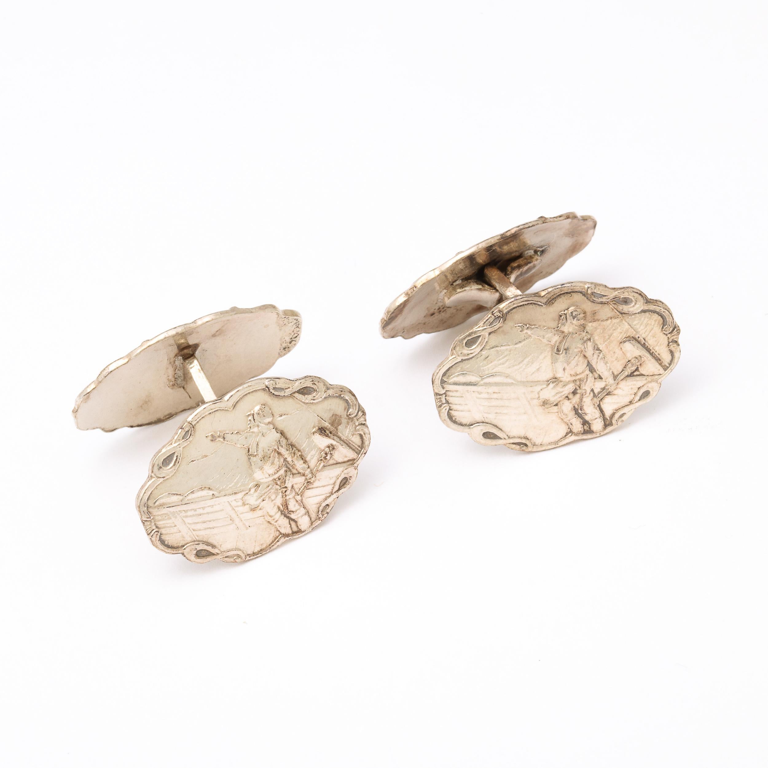 This beautiful pair of Silver Cufflinks with a scene depicting a Pointing Sailor on the deck of ship were created by the company H.C. Ostrem and originate from Norway, Circa 1930. Intended for the Officer's Training Corps (OTC), this lovely pair has