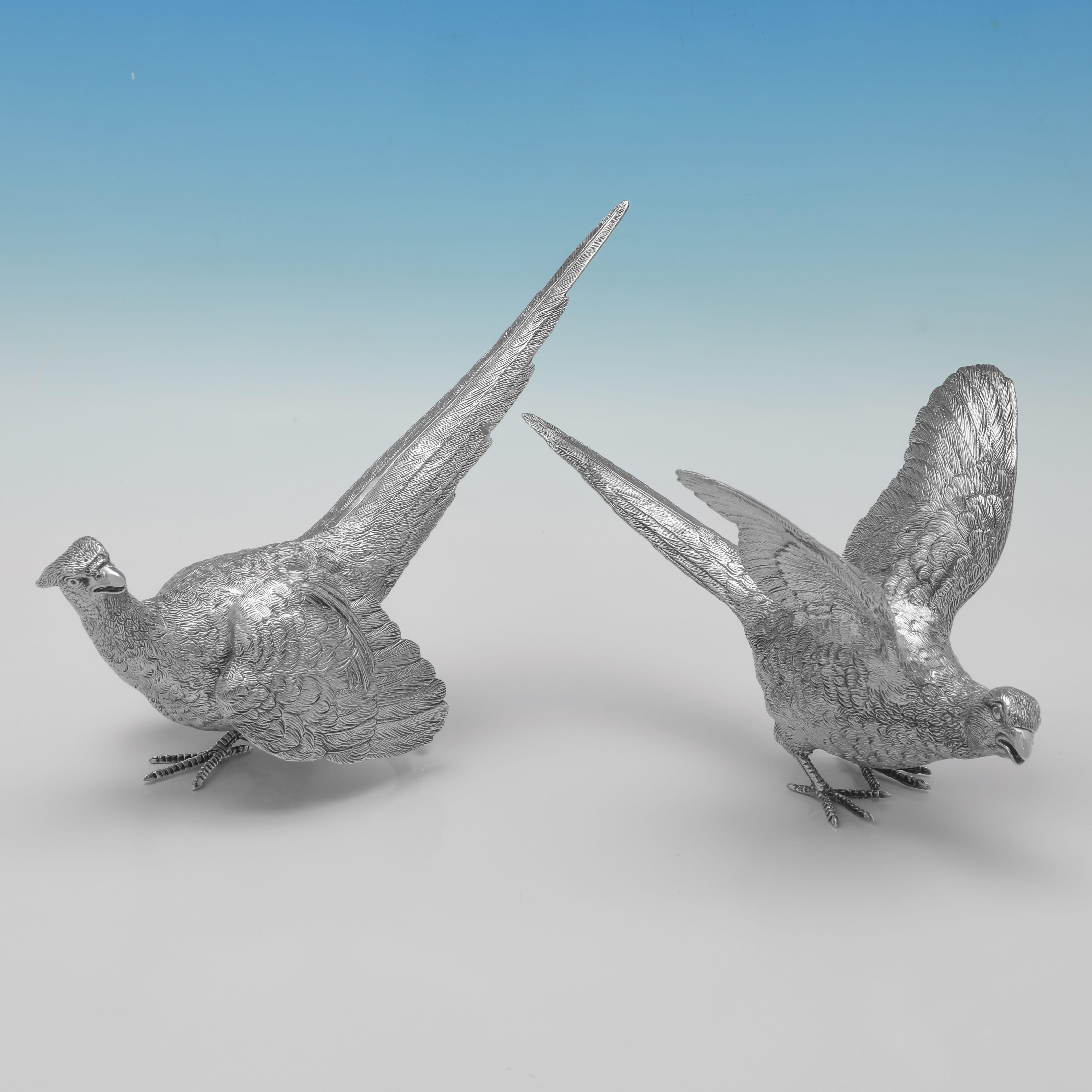 Hallmarked in Sheffield in 1993 by C. J. Vander, this handsome pair of Elizabeth II period, Sterling Silver Pheasants, are realistically cast. The pair together weigh 32.58 troy ounces.
 
The male measures 6.5