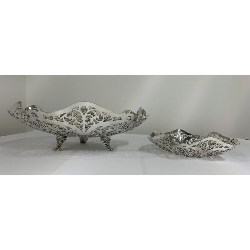 These intricately pierced dishes are in excellent condition. They have lovely openwork with pierced and petal folded sides. They would be intended for sweets, fruit, cake or nuts etc. The large one stands on three delicate feet. Hallmarked: Made by