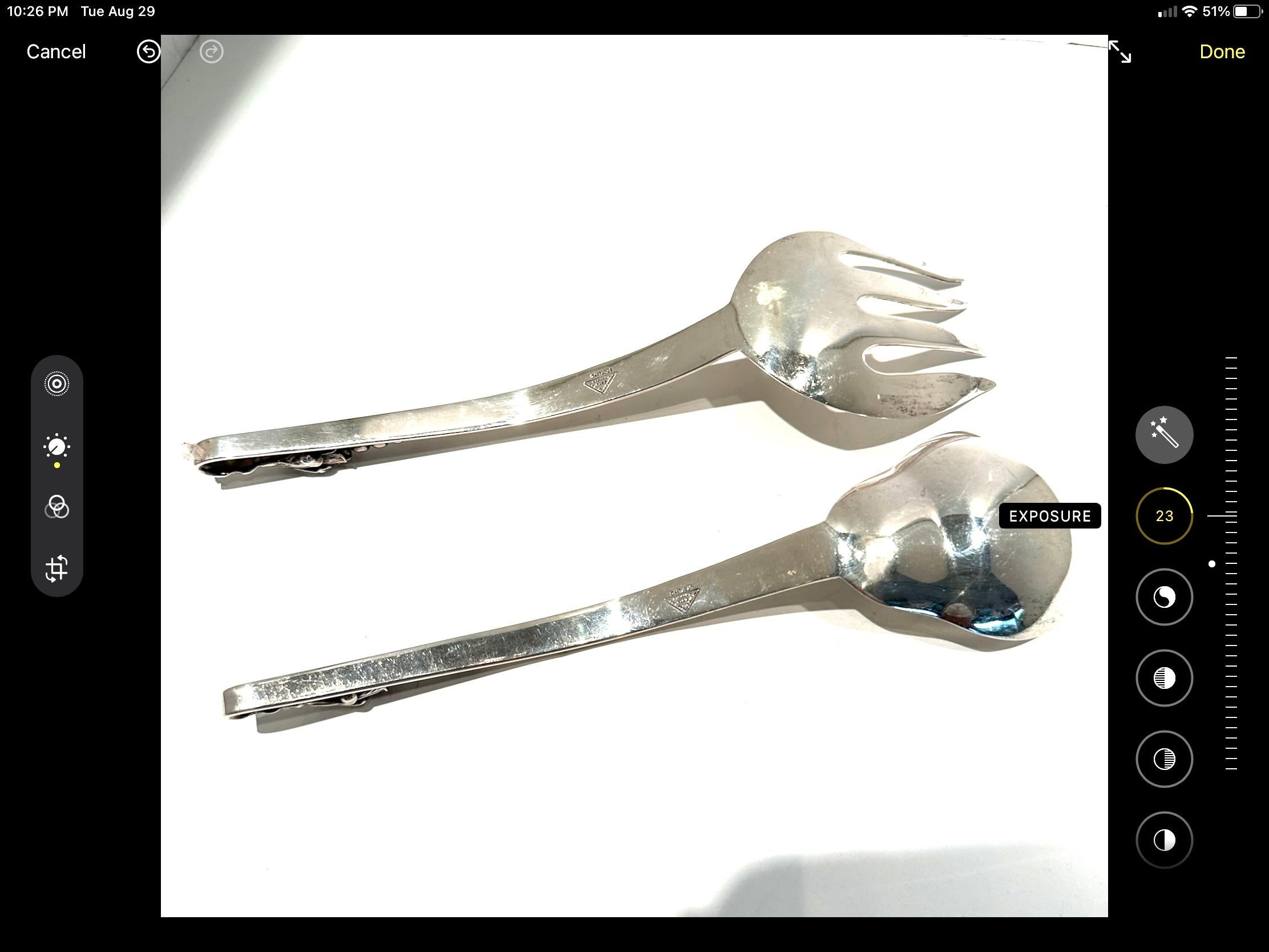 Pair of lovely pair of sterling silver Spoon and Fork for serving.  
Decorative handles looped ends with blossom and berries.
Used excellent condition.