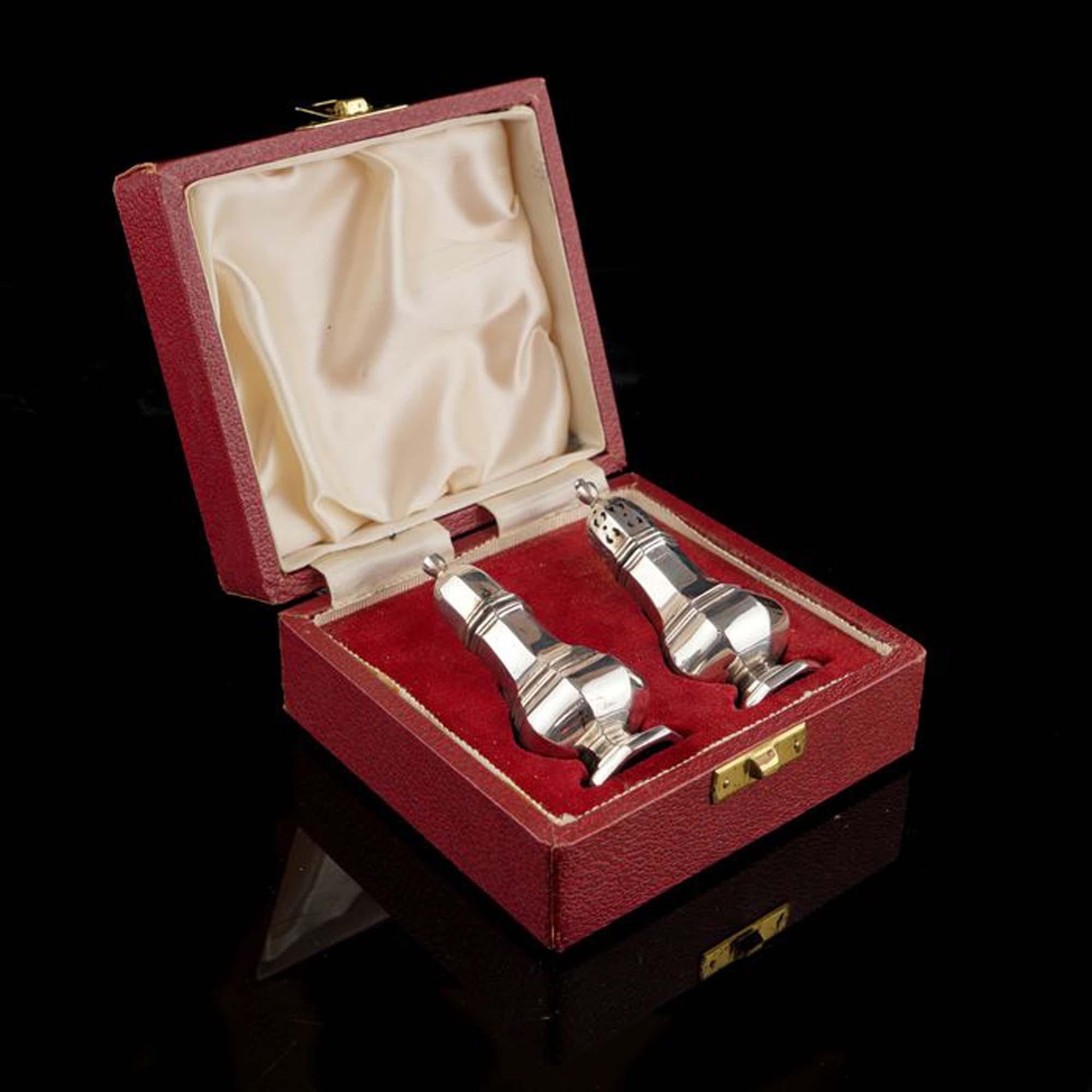 Pair of sterling silver salt and pepper.
Maker: Francis Howard Ltd 
Made in Sheffield 1943
Fully hallmarked.

Dimensions - 
Diameter x Height: 3.2 x 8.2 cm
Total Weight: 64 grams

Condition: Condition is fair, has age related marks,