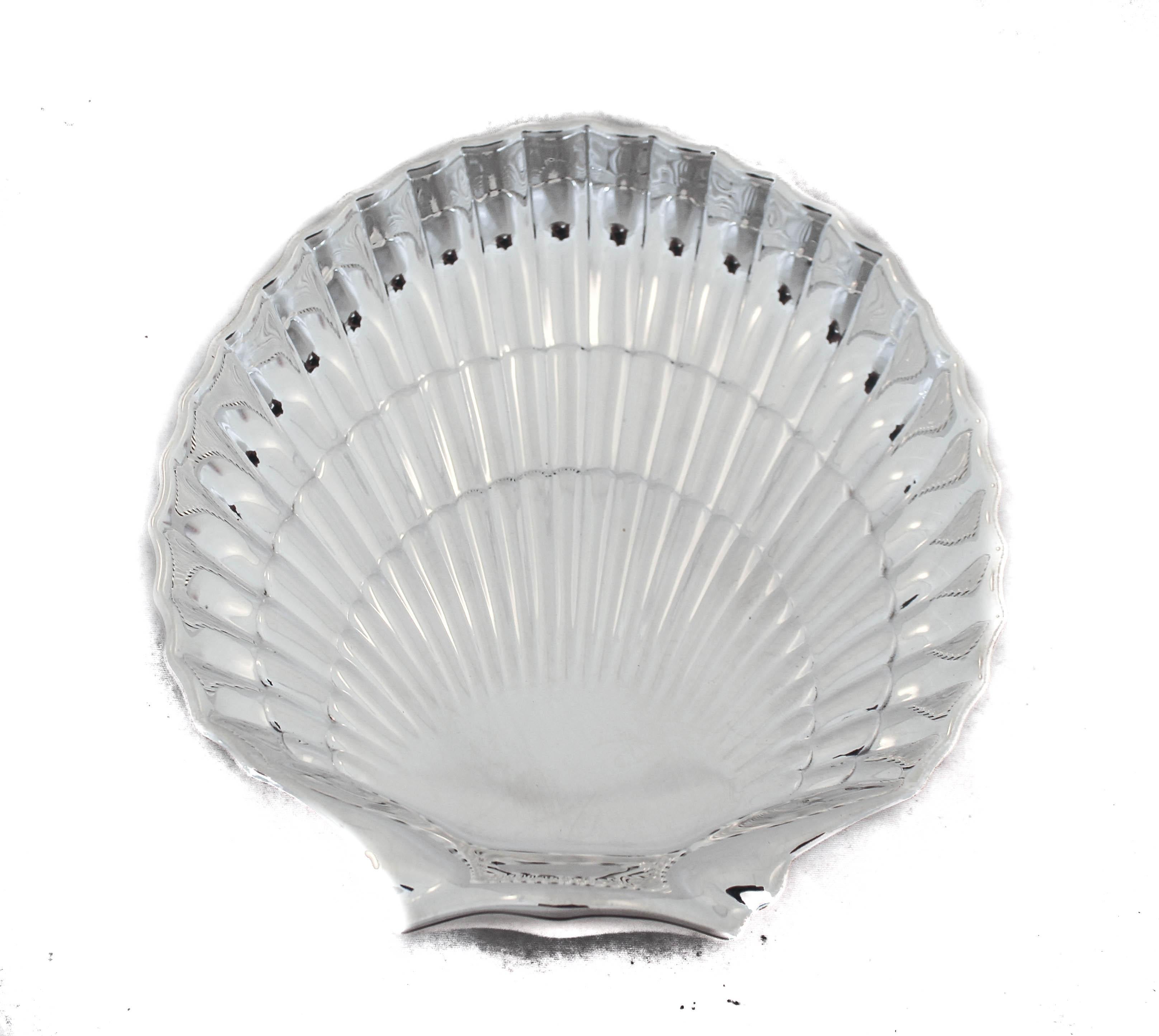 It may be winter outside but everyone is dreaming of summer inside. We are happy to offer you this pair of sterling silver shell dishes by Gorham Silversmiths of Providence, Rhode Island. We love pairs and they only make their value worth more.