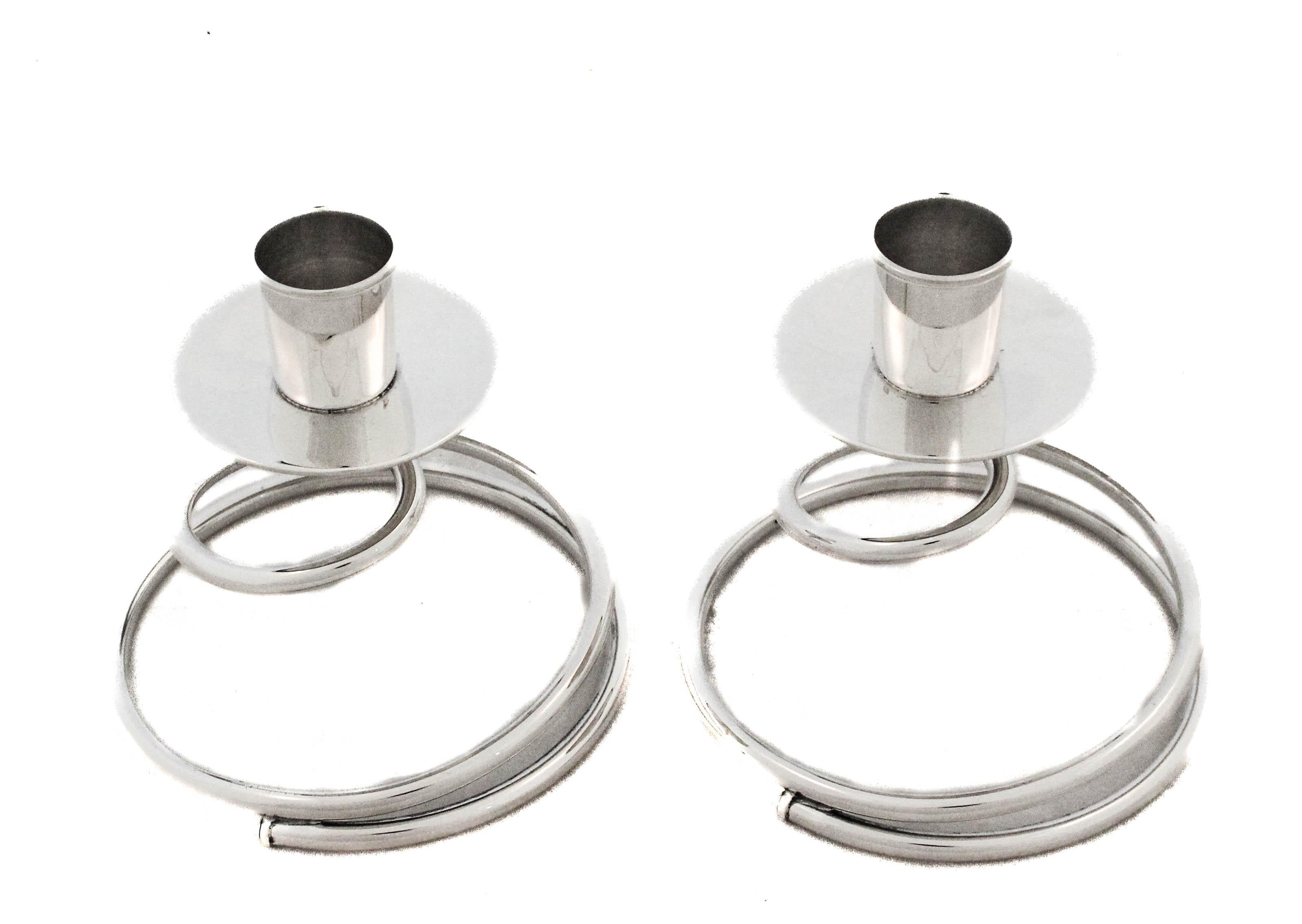 An exquisite pair of vintage sterling silver candlesticks by Fisher Silversmiths, Inc., crafted with refined elegance and preserved in mint condition. Each piece showcases the superior workmanship and classic design language for which Fisher