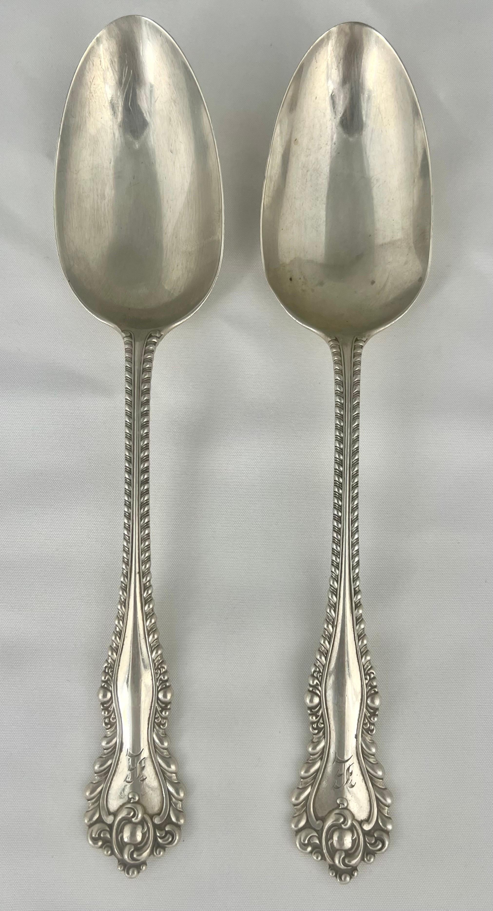 Pair of early 20th-century sterling silver serving spoons with an 