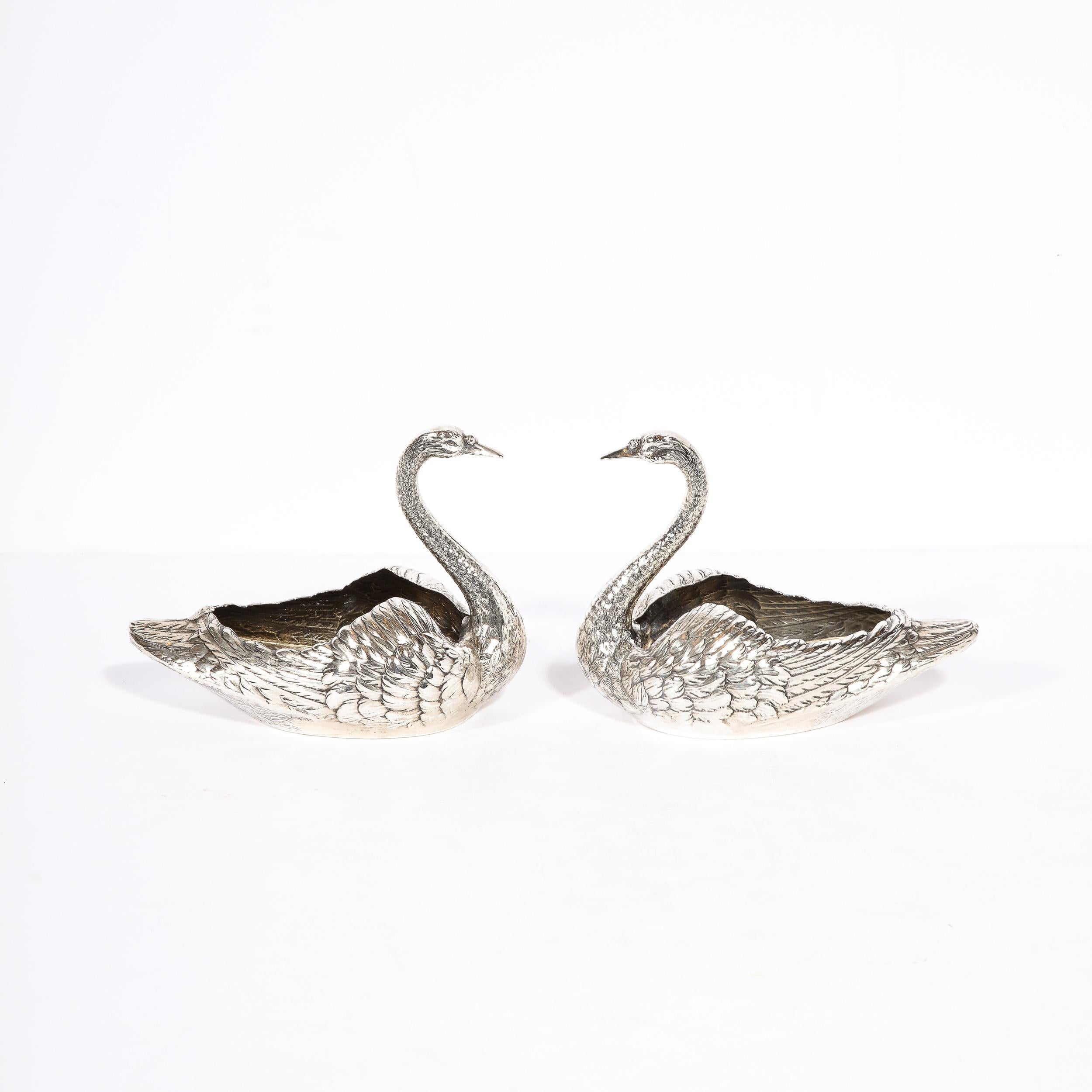 This beautiful pair of Art Deco Sterling silver swan decorative bowls were executed by the legendary American silver maker, Gorham circa 1920. They feature elegantly streamlined demilune form bottoms and undulating tops. The stylized and sinuous