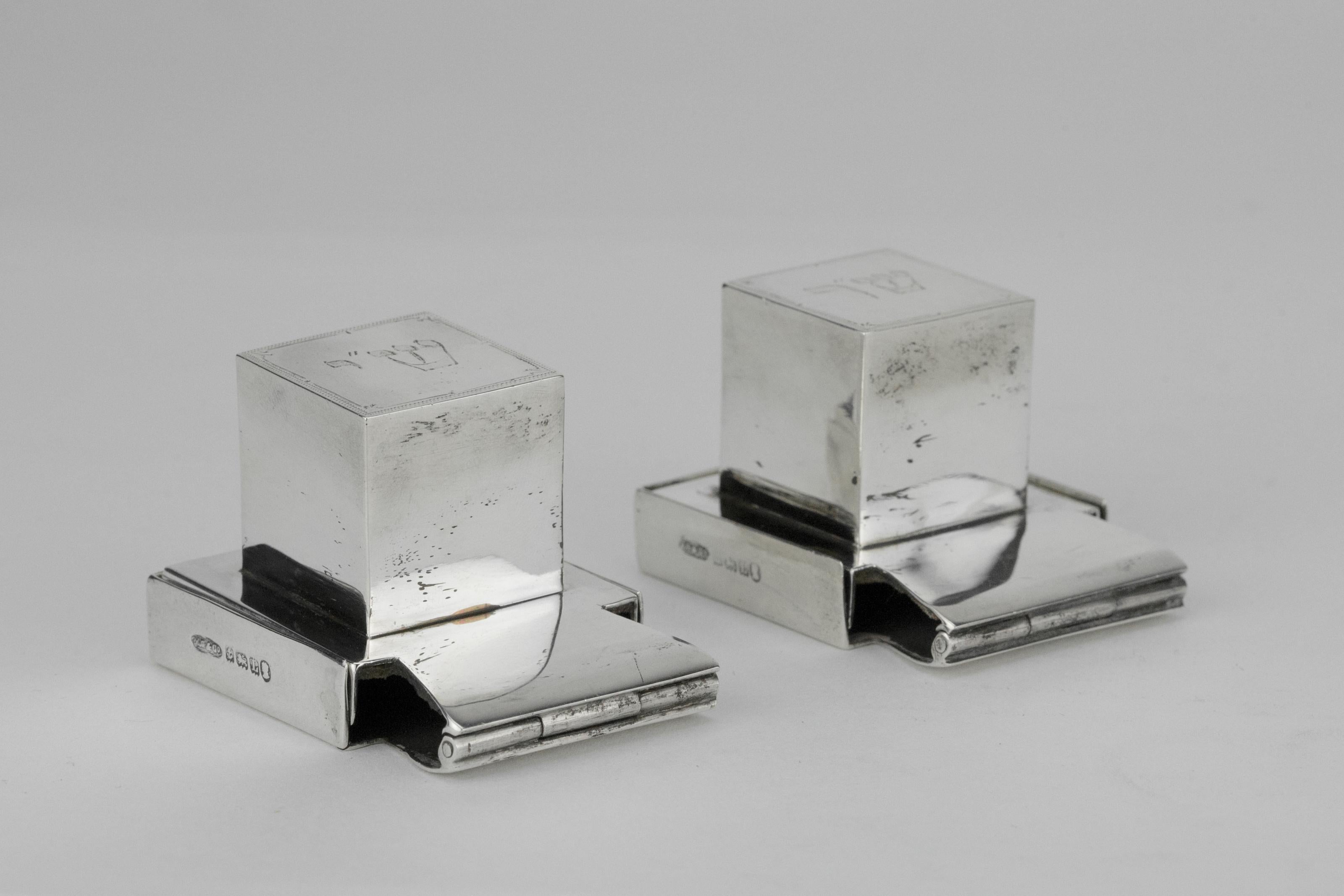 Handmade sterling silver Tefillin boxes, Birmingham, England, 1935.
Square boxes with hinged bases that open and close.
Hebrew inscription on the top of the boxes: Shin Yud = Shell Yad, Shin Resh = Shel Rosh.
Marked on the sides with English silver