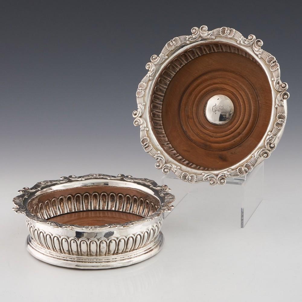 Pair of Sterling Silver Wine Coasters London, 1811

Additional Information:
Date: Hallmarked in London in 1811 - no makers mark rubbed
Period: Regency
Origin: London, England
Decoration: Roccoco scrolled rim, gadrooned body.
Size: H 4.8cm x