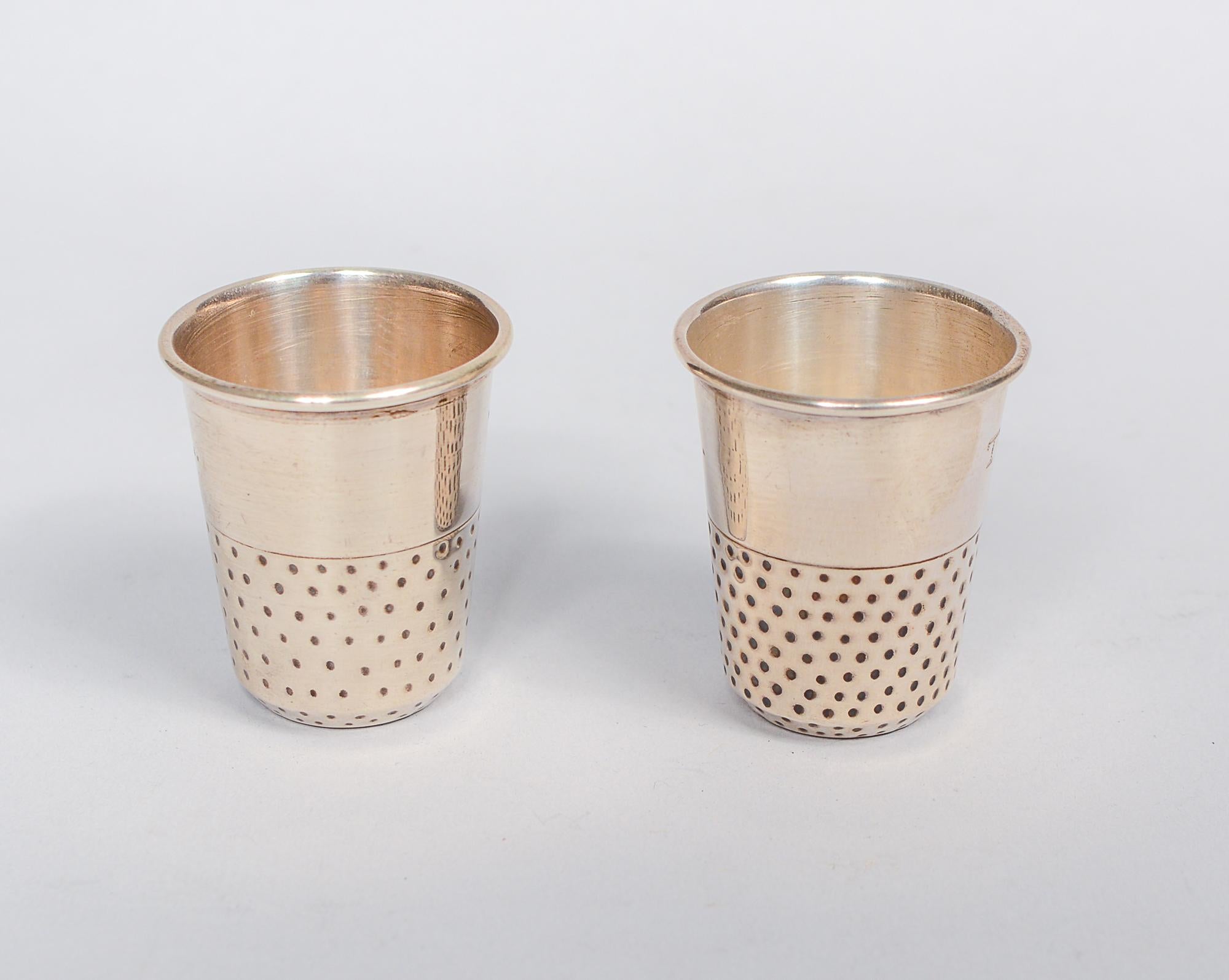 Pair of sterling silver shots or jiggers by Rancho Alegre, Taxco. These are in the form of a thimble. Each is engraved 