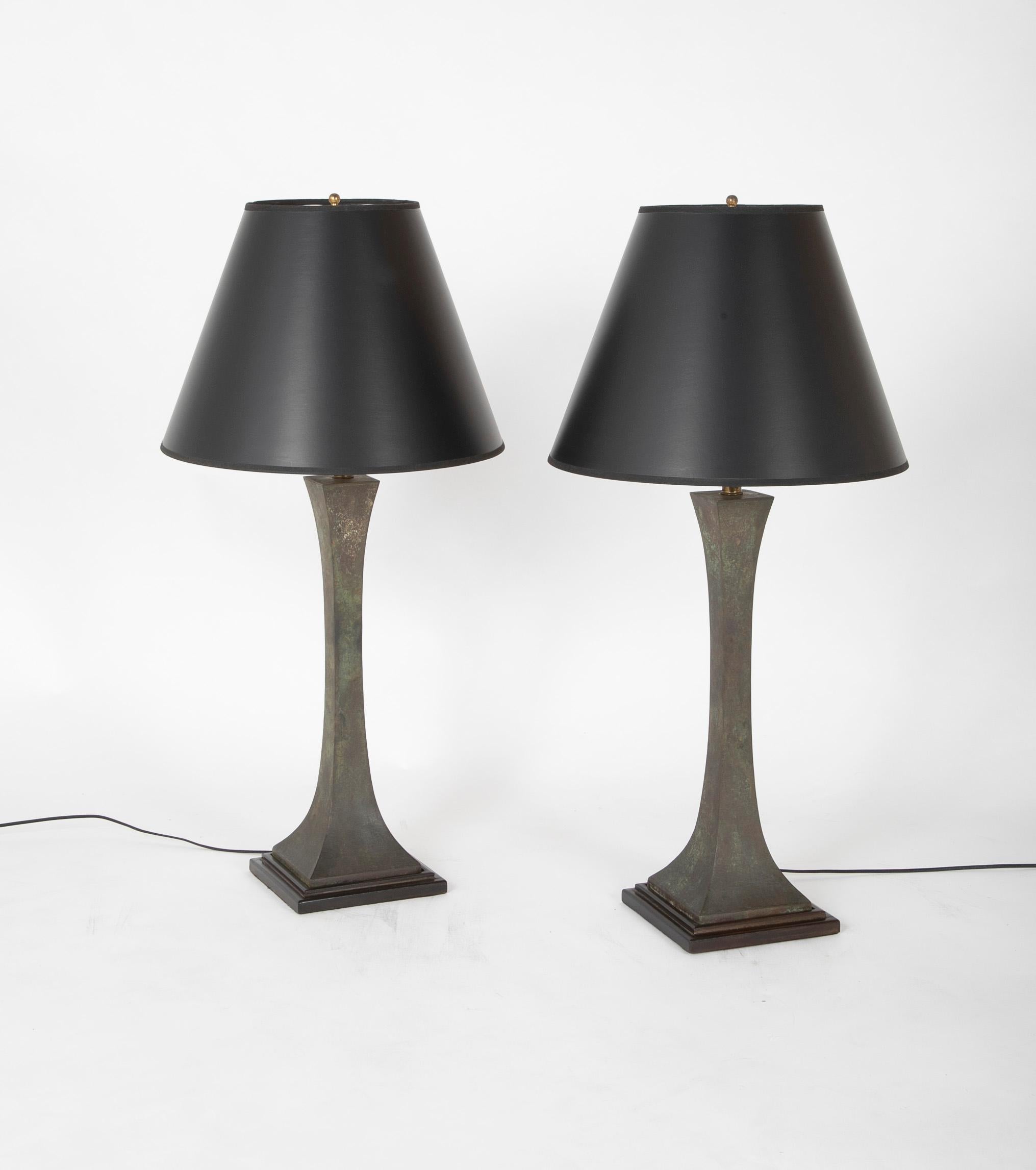 The elegant double pyramidal design of these patinated bronze table lamps give them a classical yet modern feel. The design of these lamps is timeless. Newly re-wired.
By Stewart Ross James for Hansen, USA.