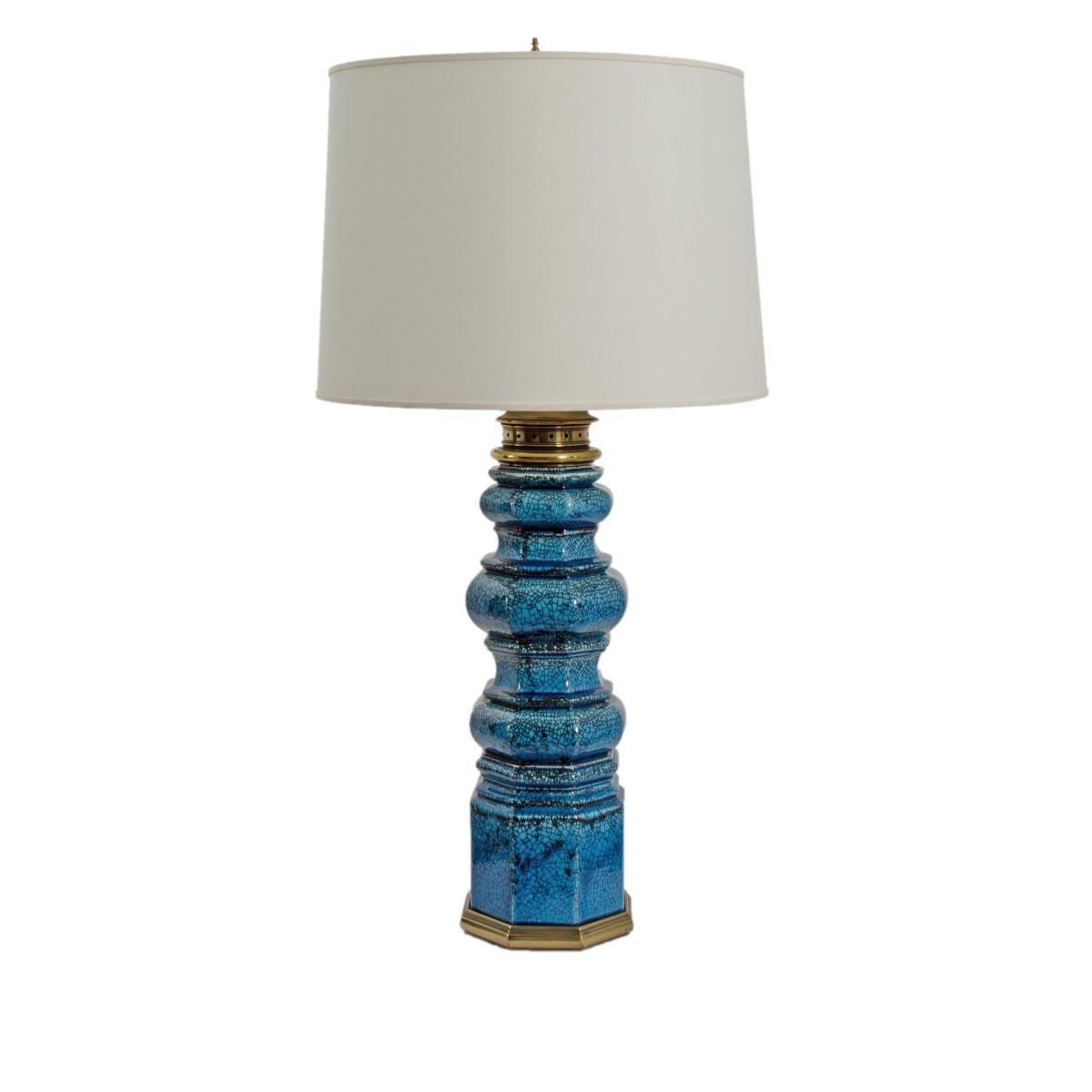 A pair of blue crackle glaze ceramic tall table lamps on brass base by Stiffel, USA, circa 1960.

Includes custom drum shades.

Wired for USA, each lamp takes a standard bulb, 75 watts max.
  