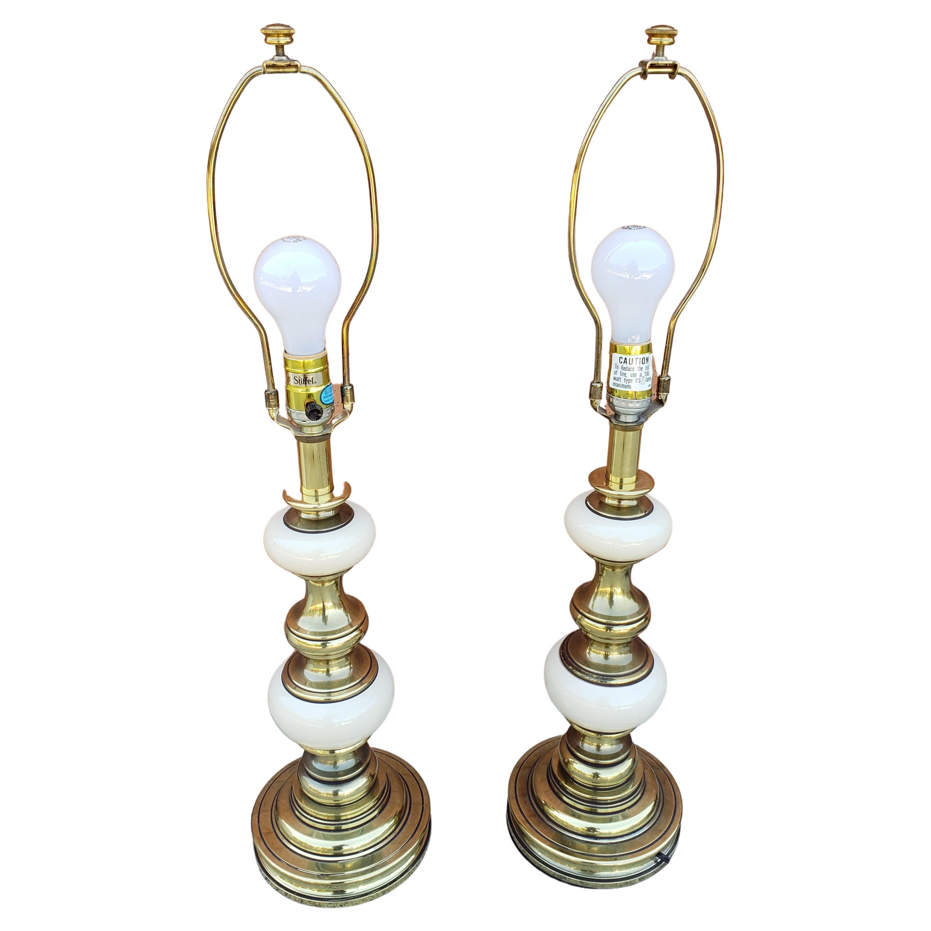 An exquisite pair of Victorian style solid brass and porcelain table lamps by Stiffel. Very good vintage condition. Comes with Stiffel original shades in good vintage condition. Measure 6.5