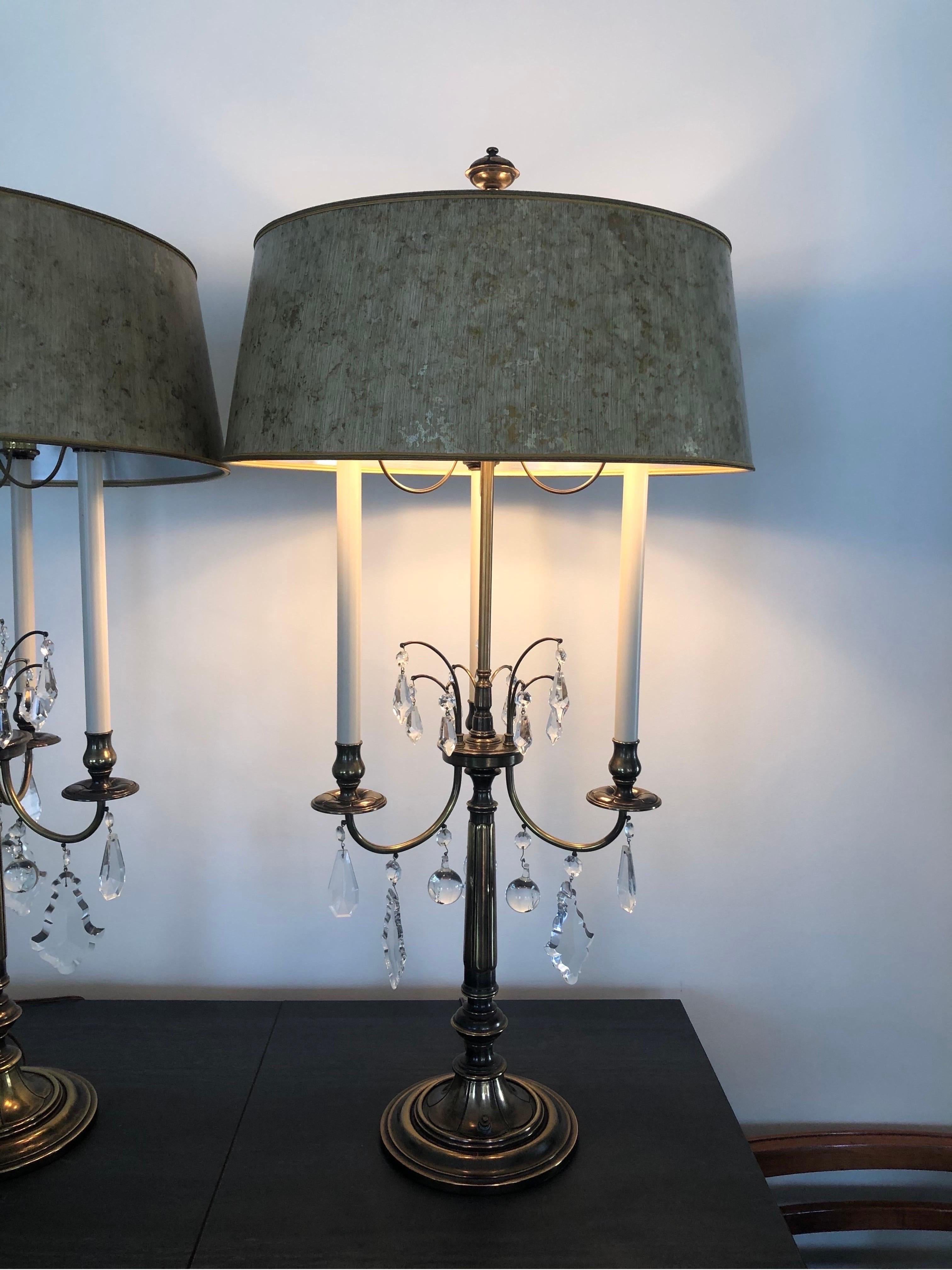 In excellent original condition, these sizable three-arm lamps are made of brass, with hanging crystals. With original cream and gold tortoiseshell shades, and stately finials.
Can deliver curbside up to 30 miles from zip code 07711. $3000.