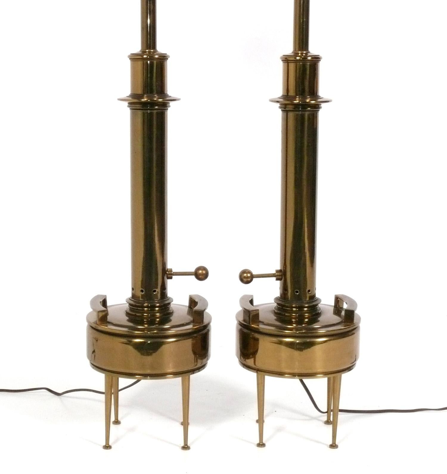 Pair of Sculptural Mid Century Modern Lamps, by Stiffel, American, circa 1950s. They retain their original shades and brass finials. They have been rewired and are ready to use. 