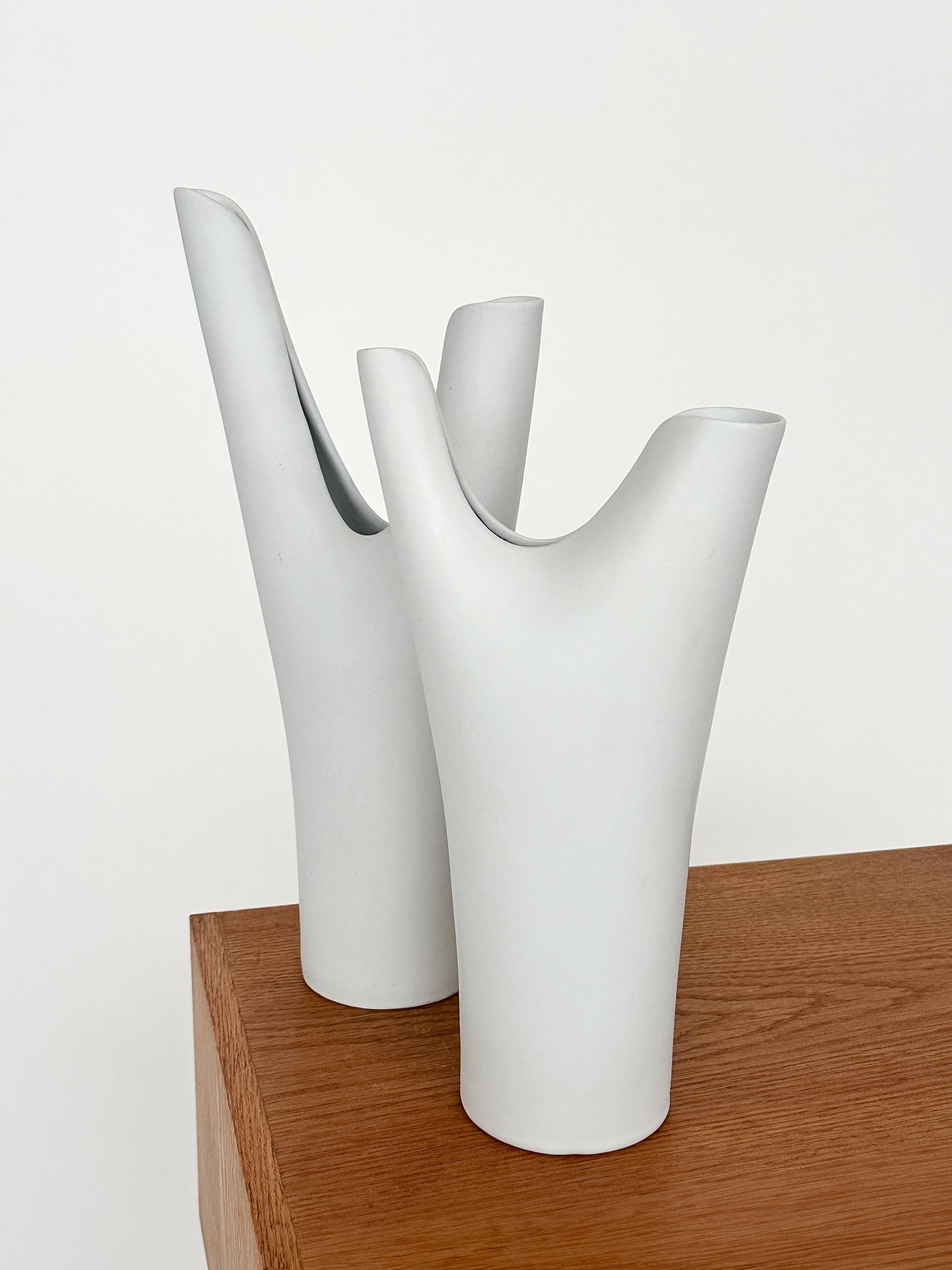 Tall pair of Stig Lindberg stoneware vases from the ‚Veckla‘ series, designed around 1952 and produced until the late 1950s to early 1960 at Gustavsberg factory in Sweden.
 
Matte white ‚Carrara‘ glaze, stamped with the Gustavsberg logo underneath.
