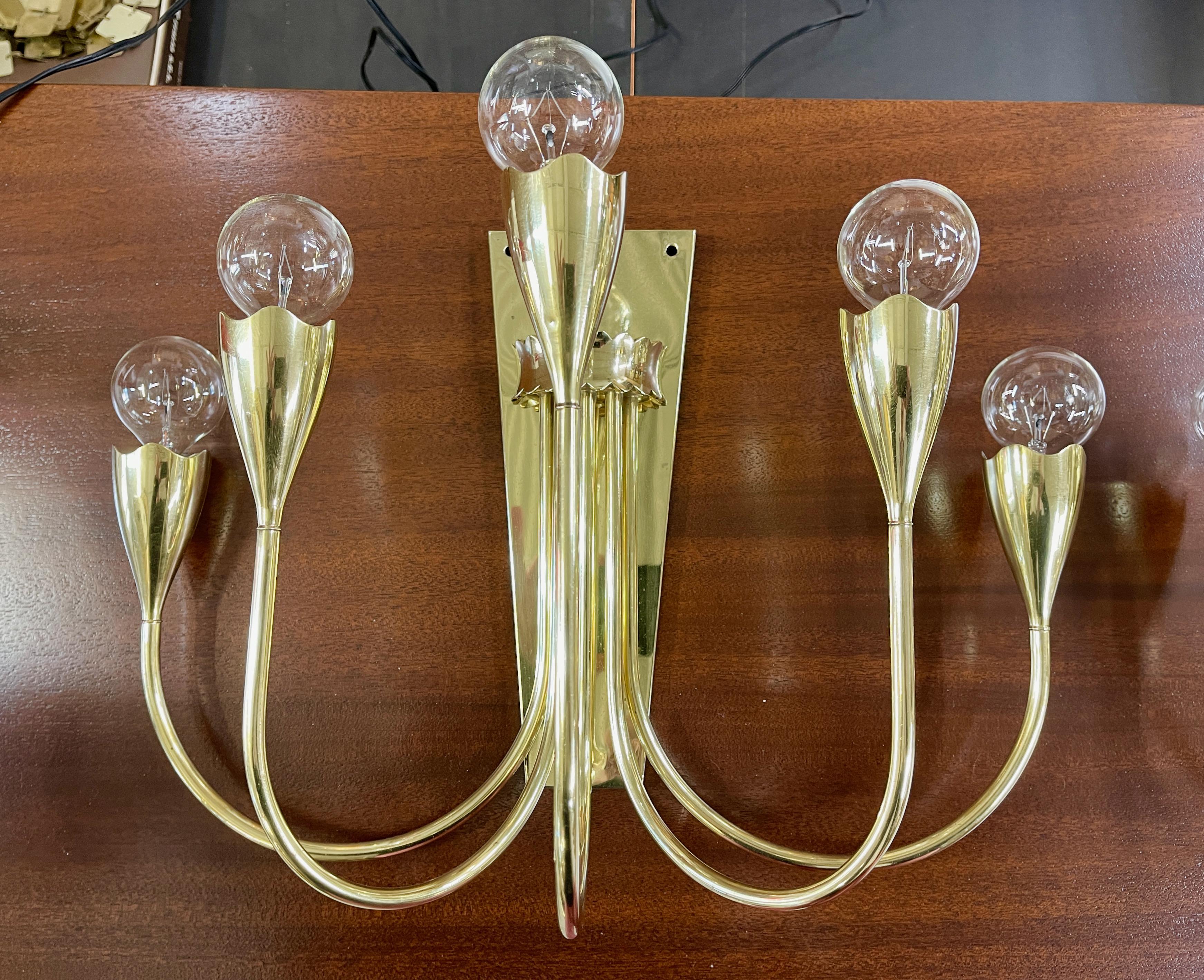 Impressive pair of 1950's artisan made Italian solid brass 5 arm candelabra sconces with lovely organic scalloped edge cups, like the bulb heads of a tulip, similar to the Model 77 floor lamp by Angelo Lelii for Arredoluce. Unusually skillful