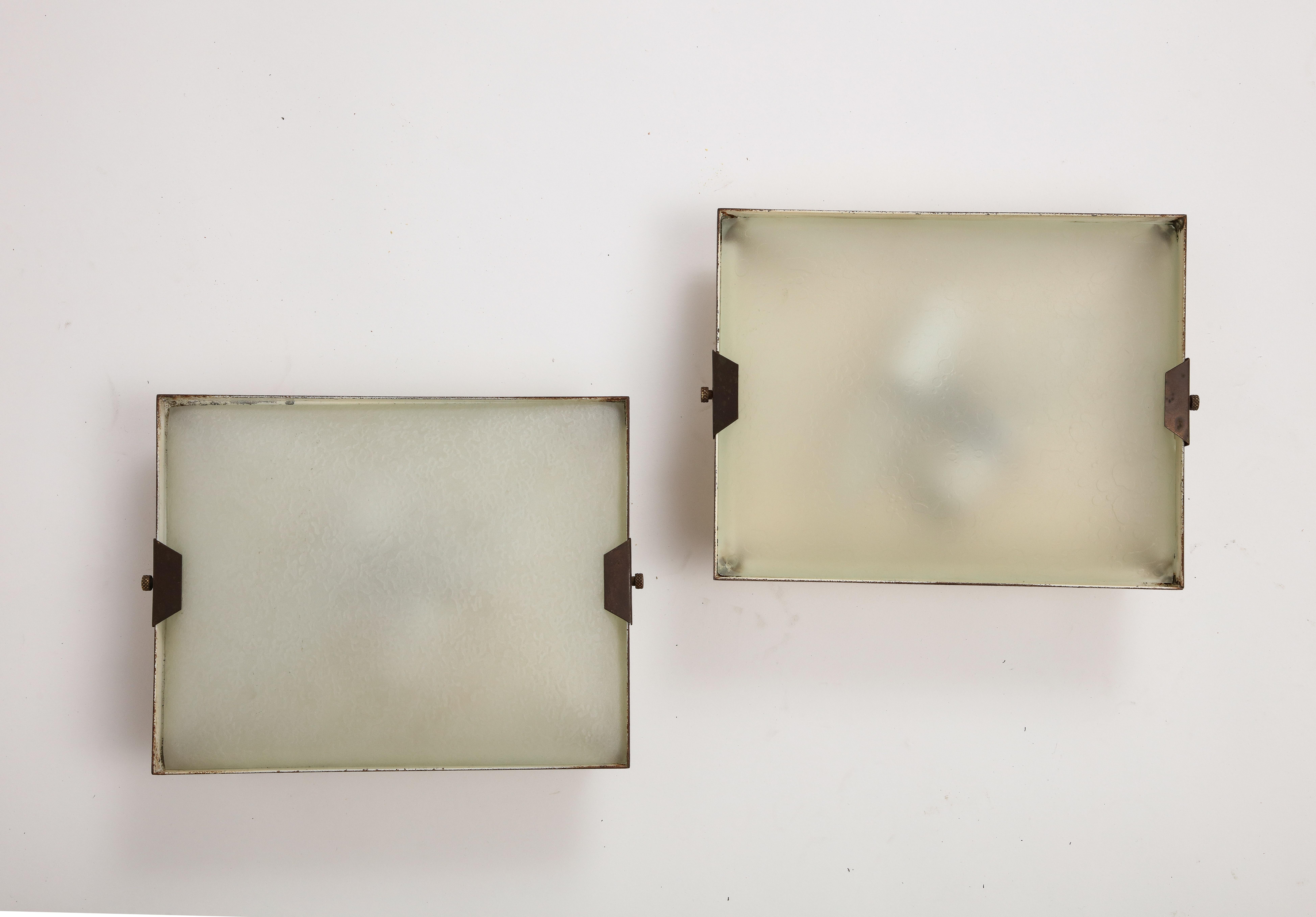 Pair of 1950s Italian brass and frosted glass wall lamps / sconces by Stilnovo. Wired for USA + UL listed in 2022. Stamped Stilnovo.