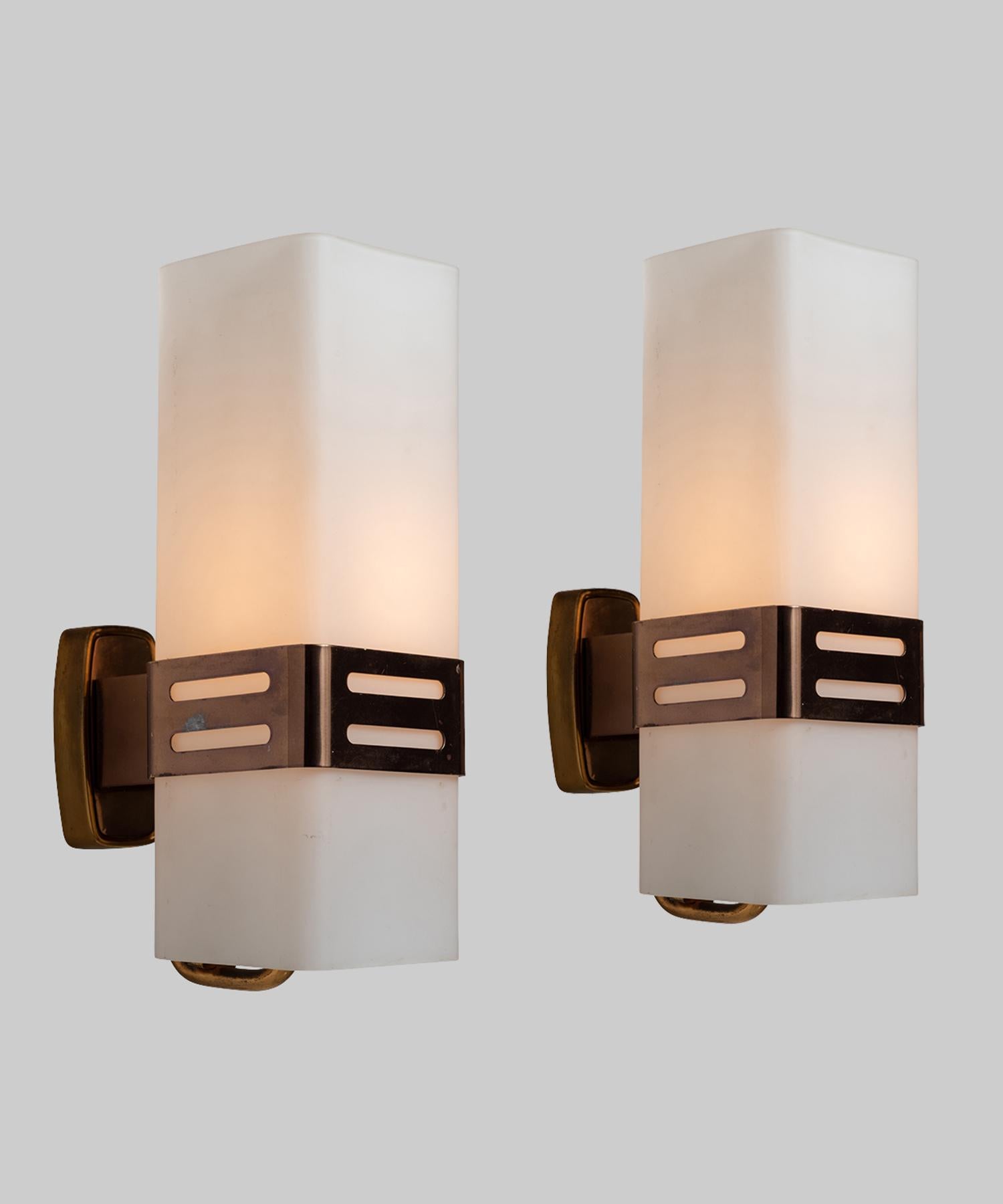 Brass structure with white opaline glass diffuser.