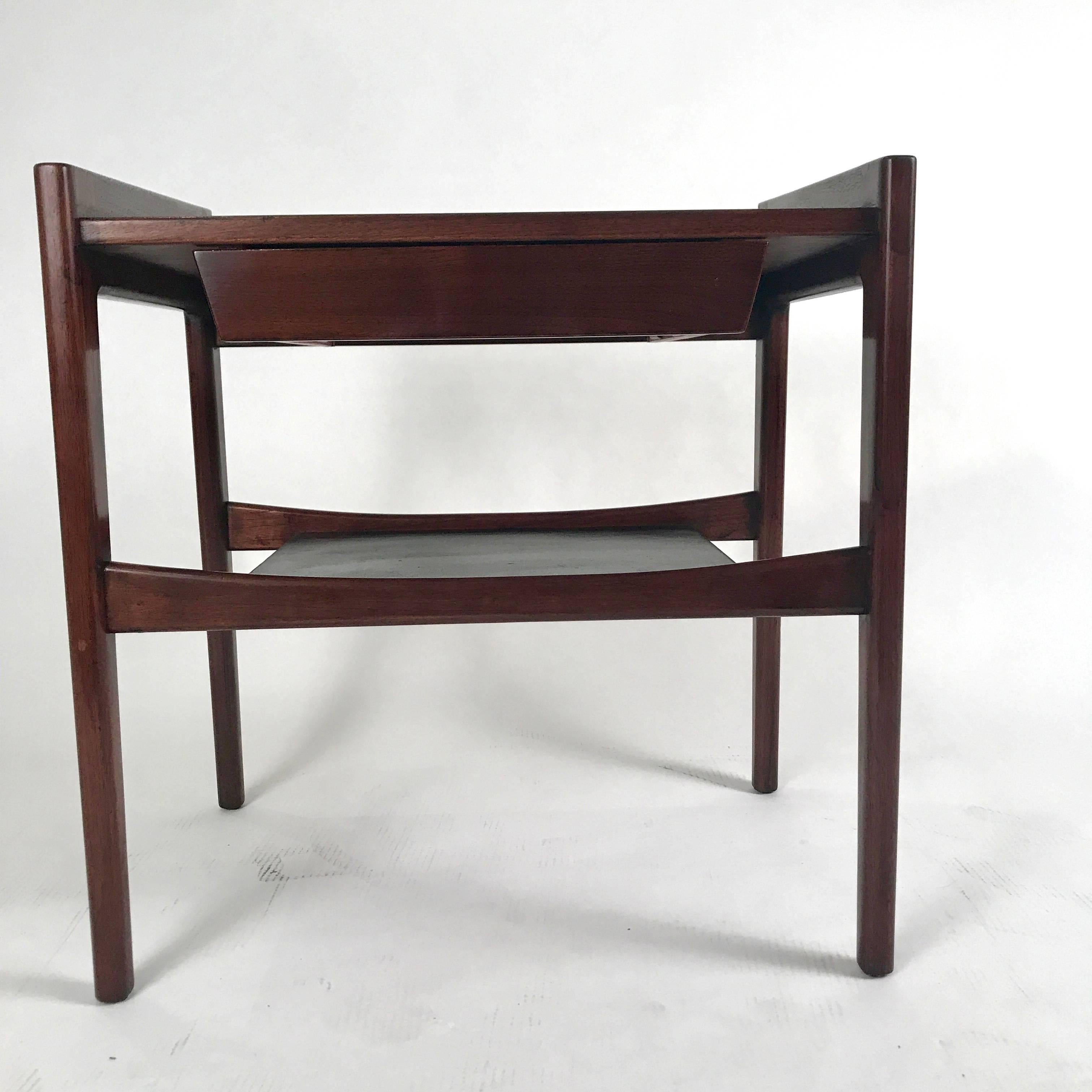 Rare pair of sculptural, seldom offered Jens Risom nightstands or end tables with a sleek single drawer and leather covered shelf. Can function as either bedside or sofa side tables. Gorgeous lines!