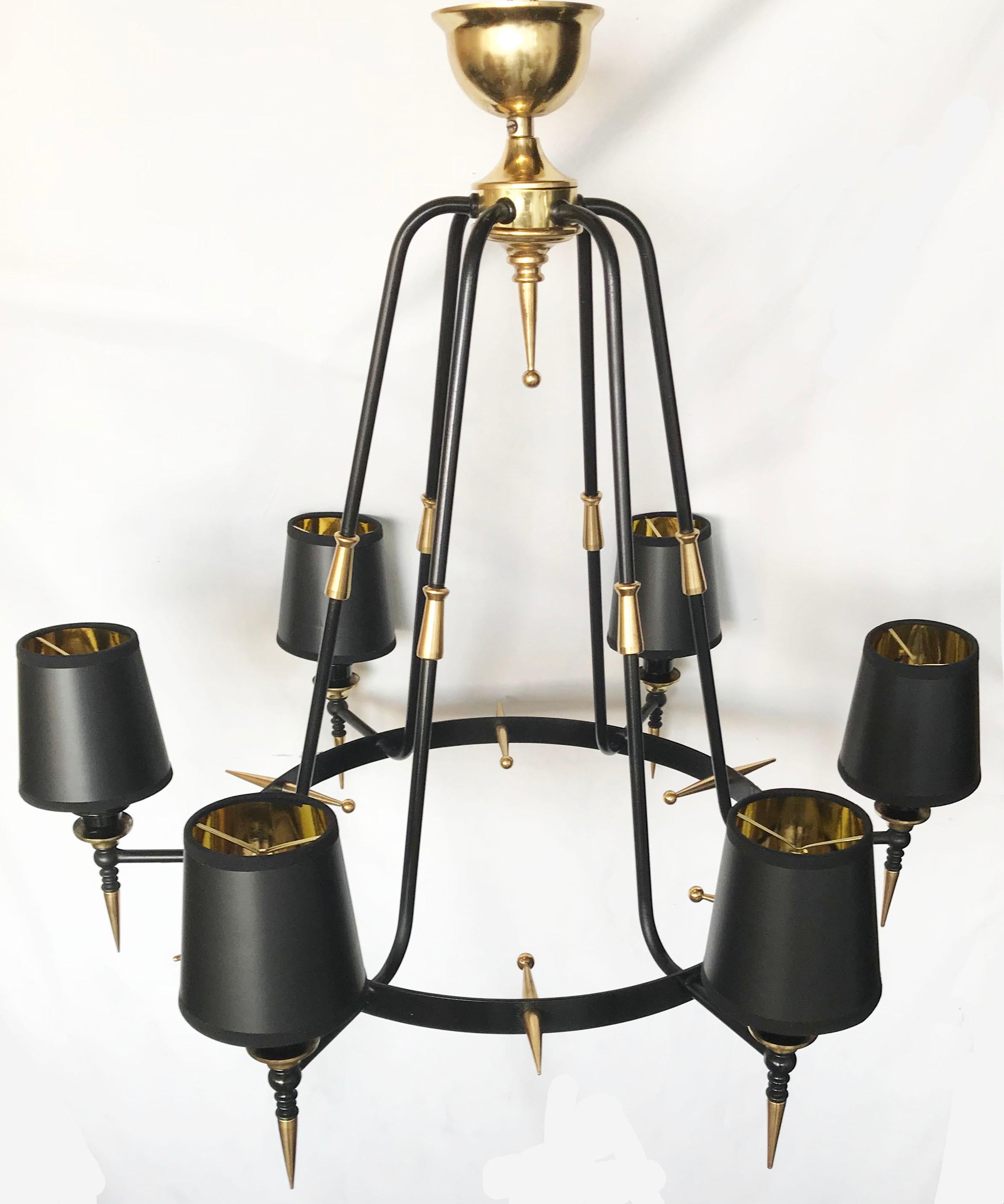 Superb pair of black and brass Finish Stilnovo style Chandeliers.
6 Lights , 40 watts max per lights.
US rewired and in working condition.
Completely restored and refinished.
