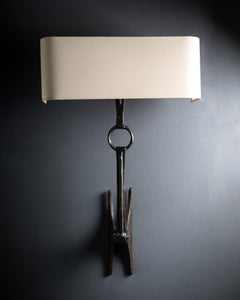 Pair of ‘Stirrups’ bronze wall-lights, by Félix Agostini