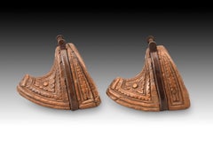 Pair of stirrups. Carved wood, iron. Chile, 18th century.