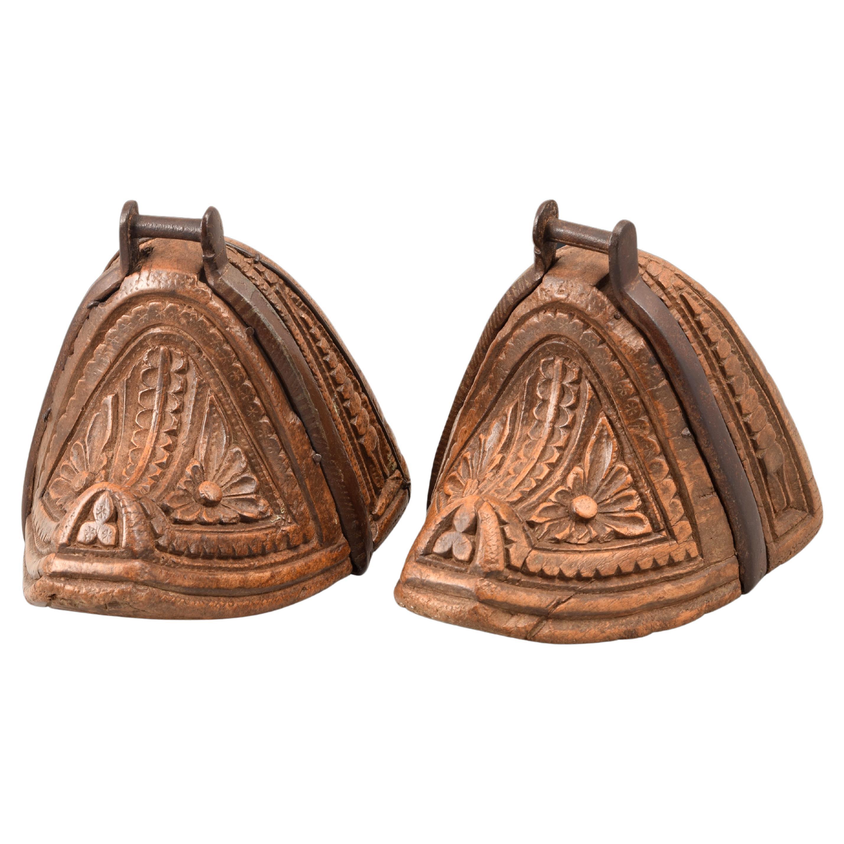 Pair of stirrups. Carved wood, iron. Chile, 18th century. 