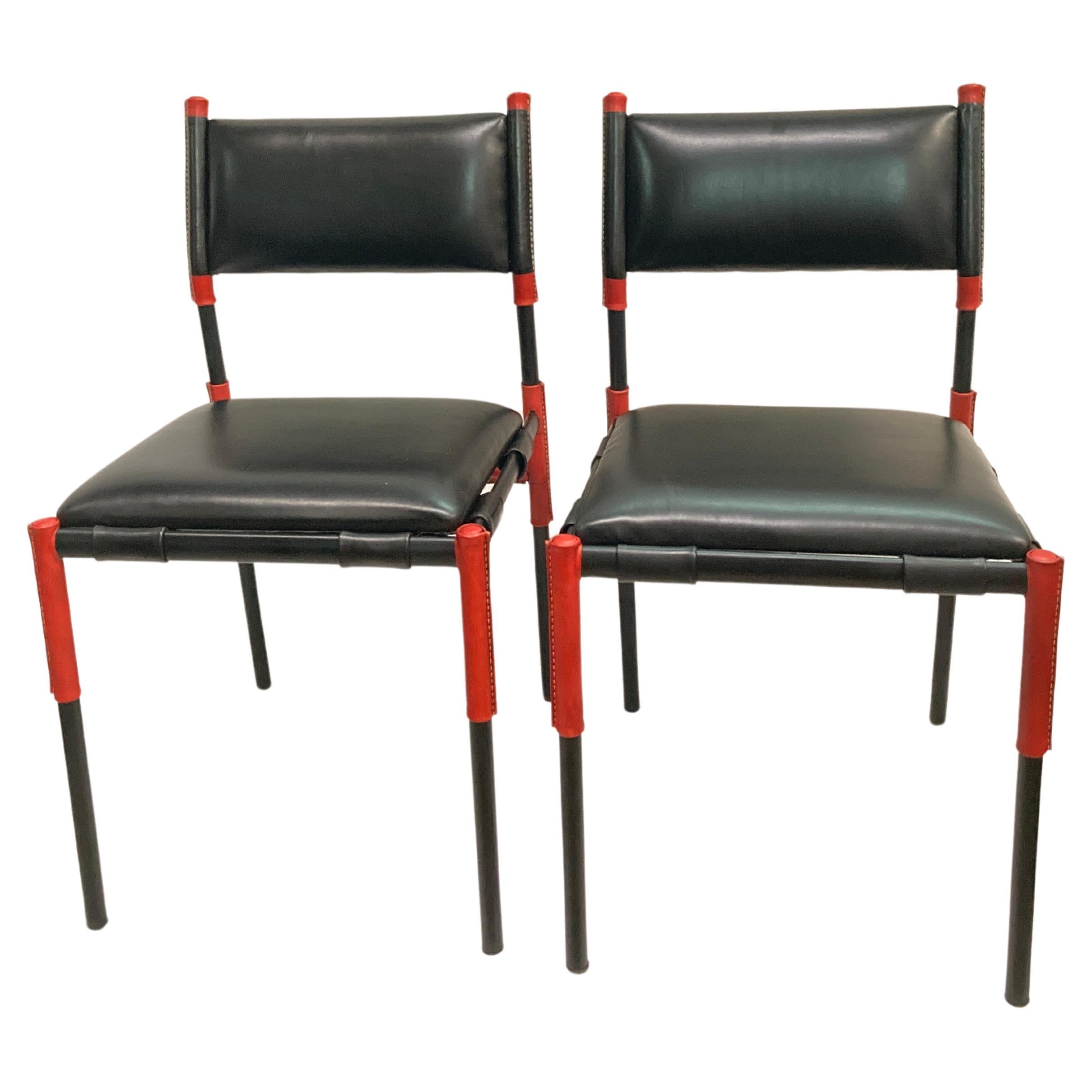 Pair of Stitched leather chairs by Jacques Adnet For Sale