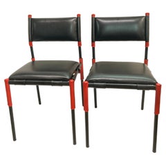 Pair of Stitched leather chairs by Jacques Adnet