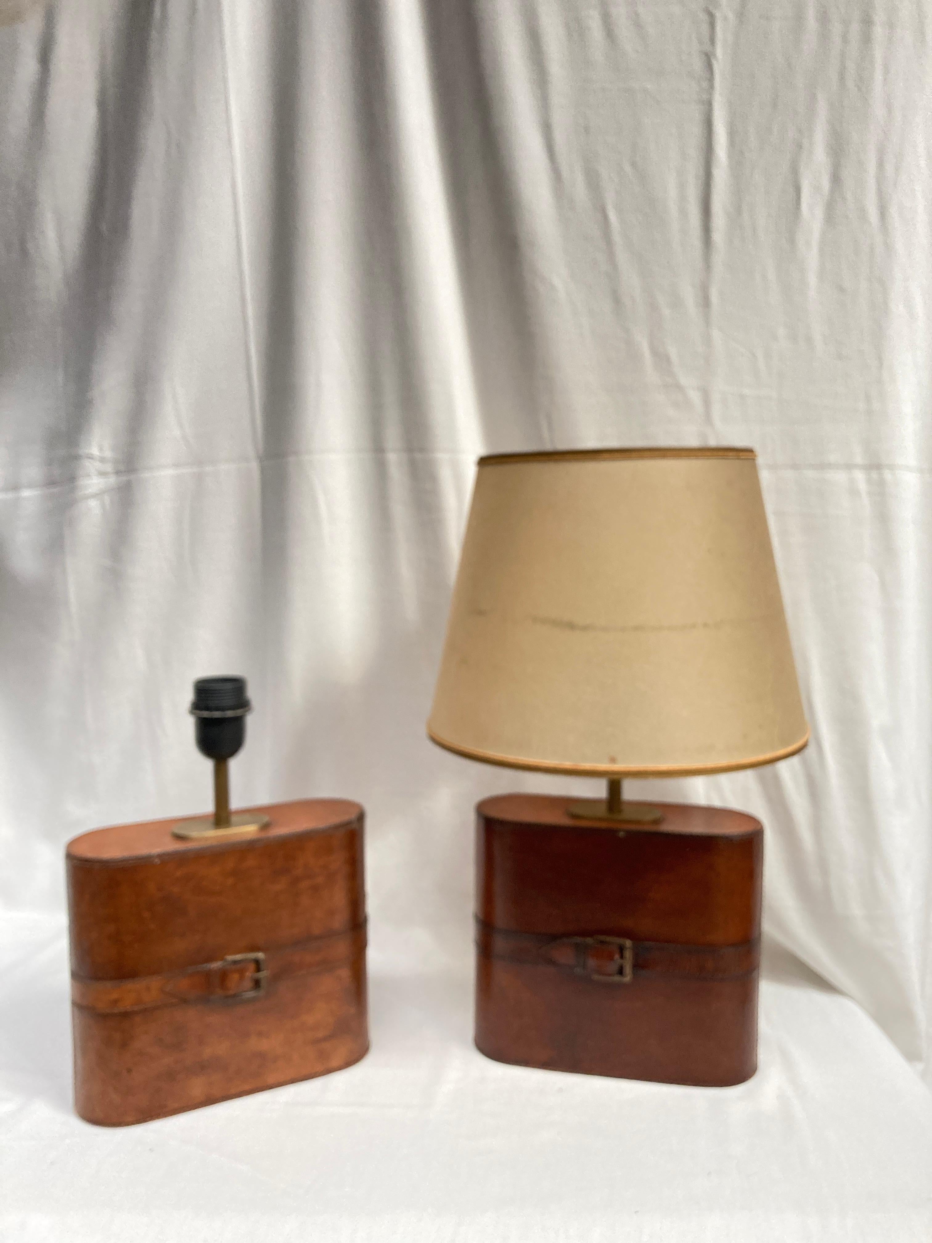 Pair of stitched leather lamps in the style of Jacques Adnet
