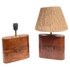 Pair of Stitched leather lamp in the style of Jacques Adnet