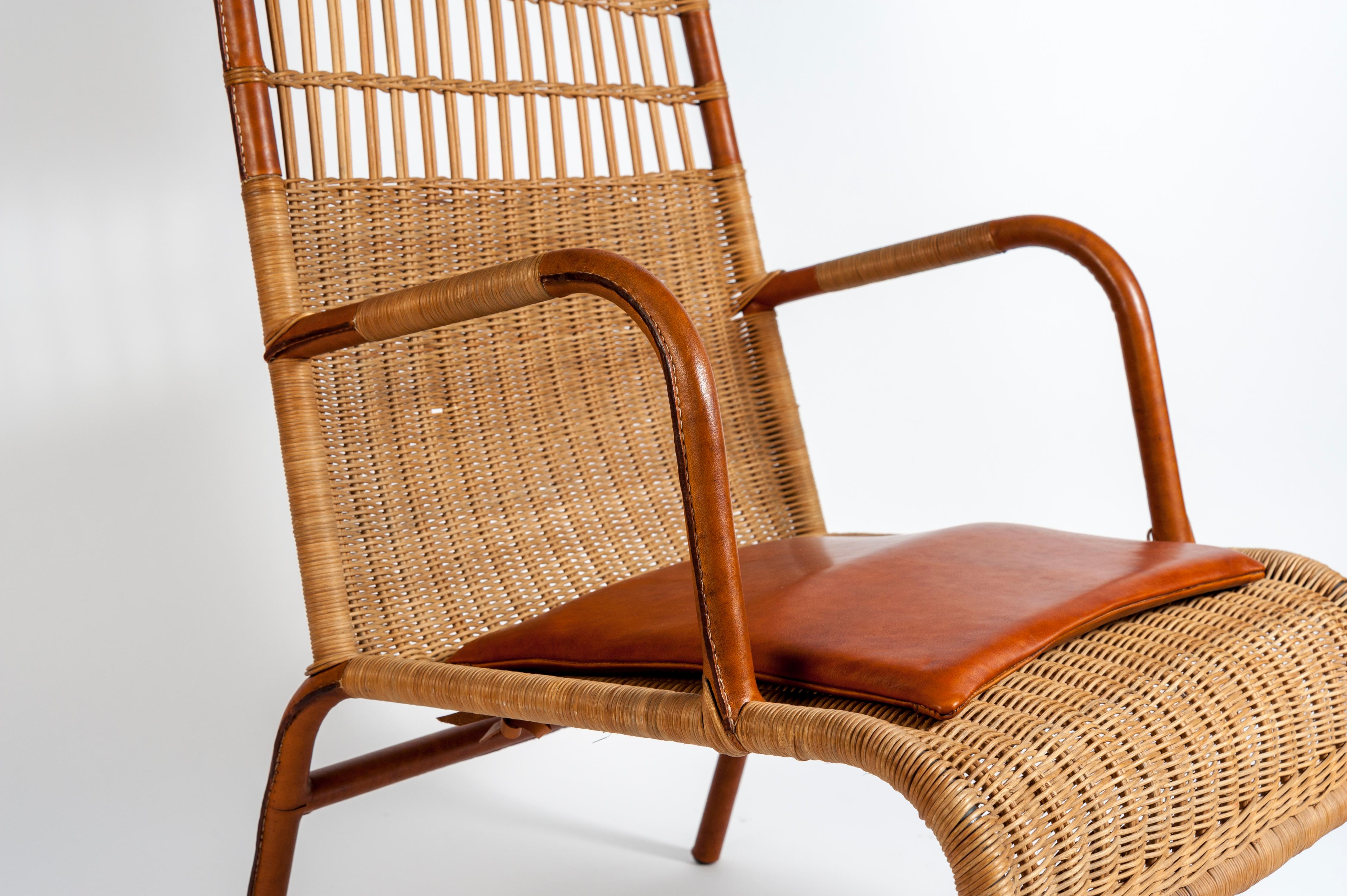French Pair of Stitched Leather and Rattan Armchairs by Jacques Adnet