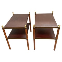 Pair of stitched leather tables by Jacques Adnet