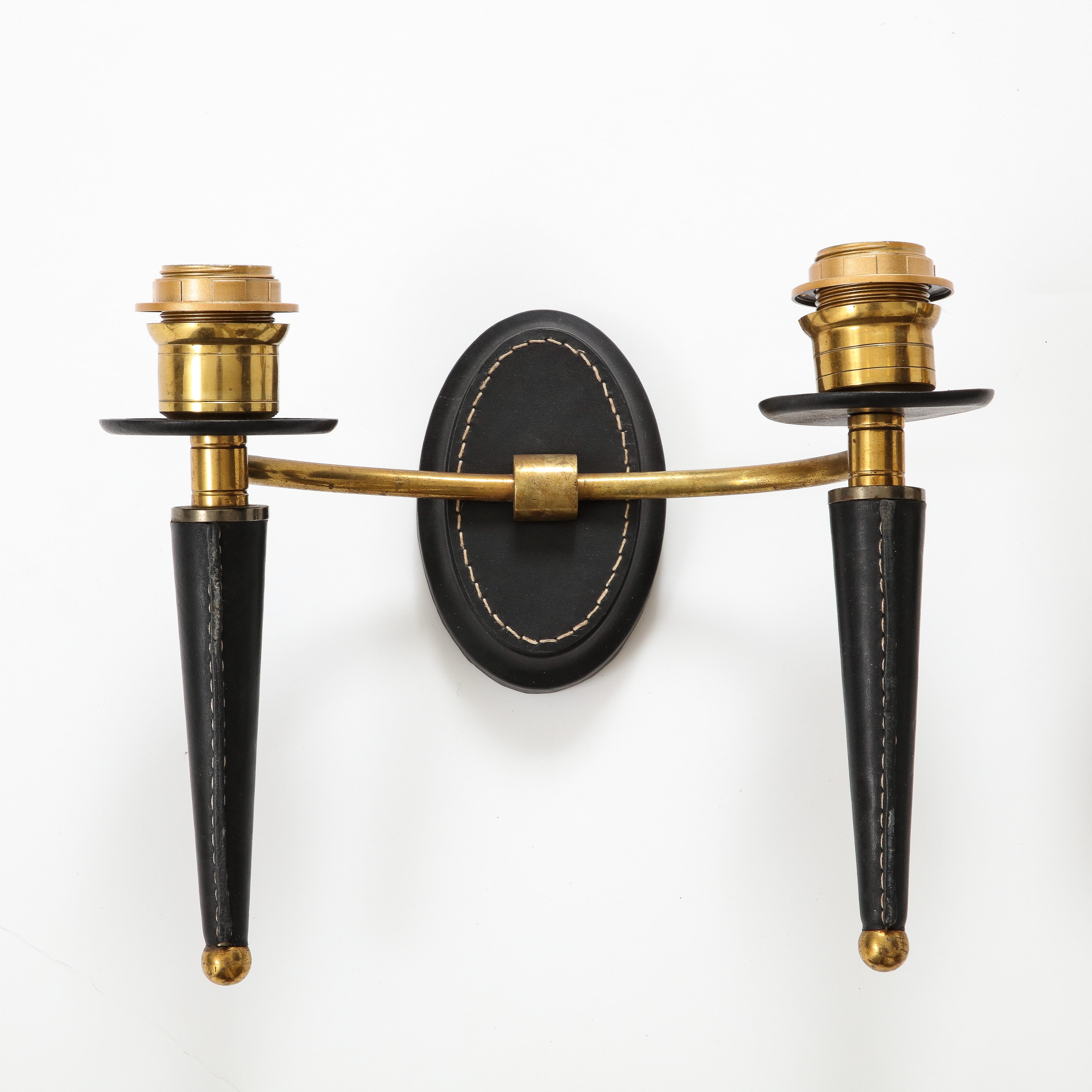 French Pair of stitched leather wall light by Jacques Adnet For Sale