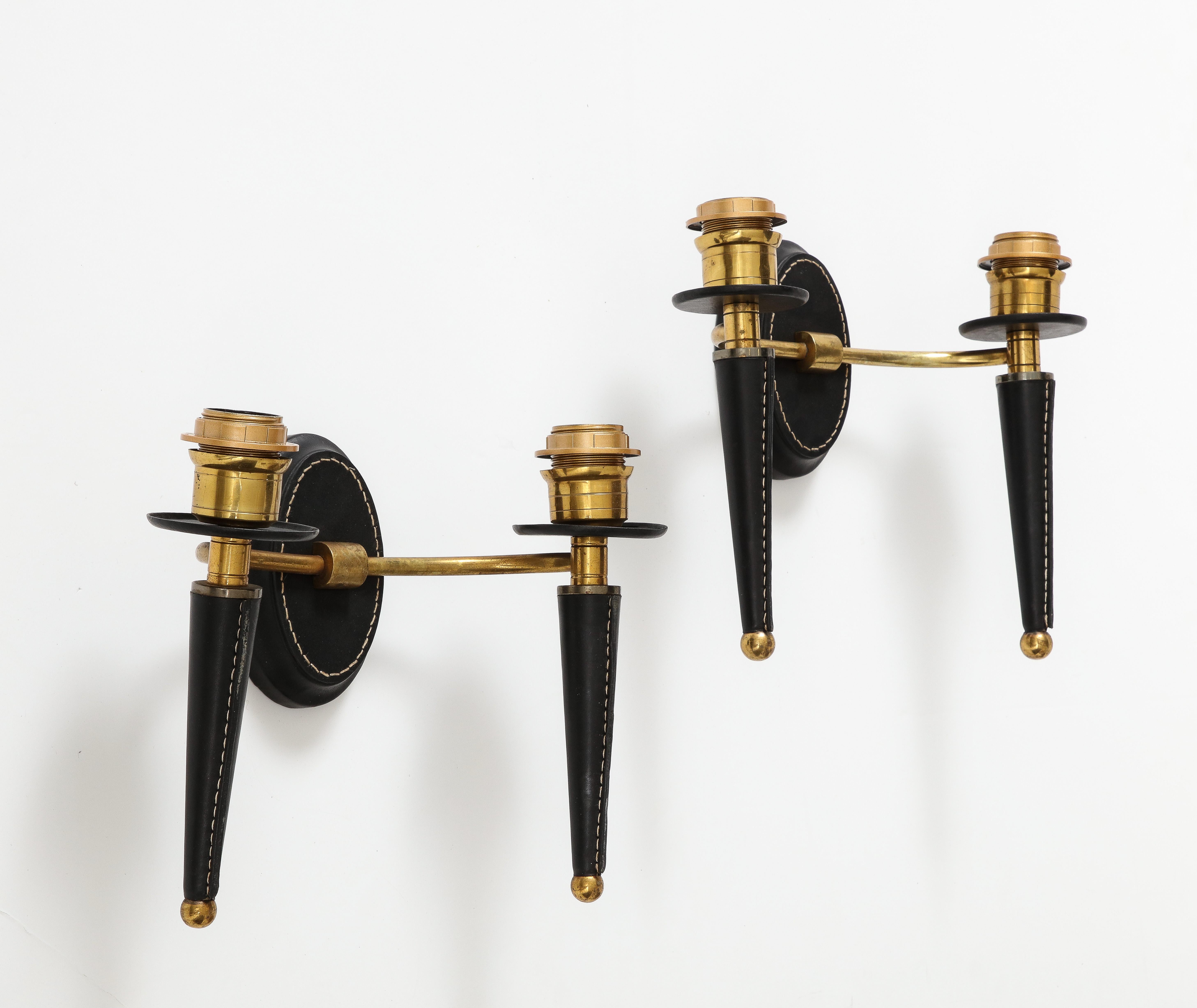 Mid-20th Century Pair of stitched leather wall light by Jacques Adnet For Sale