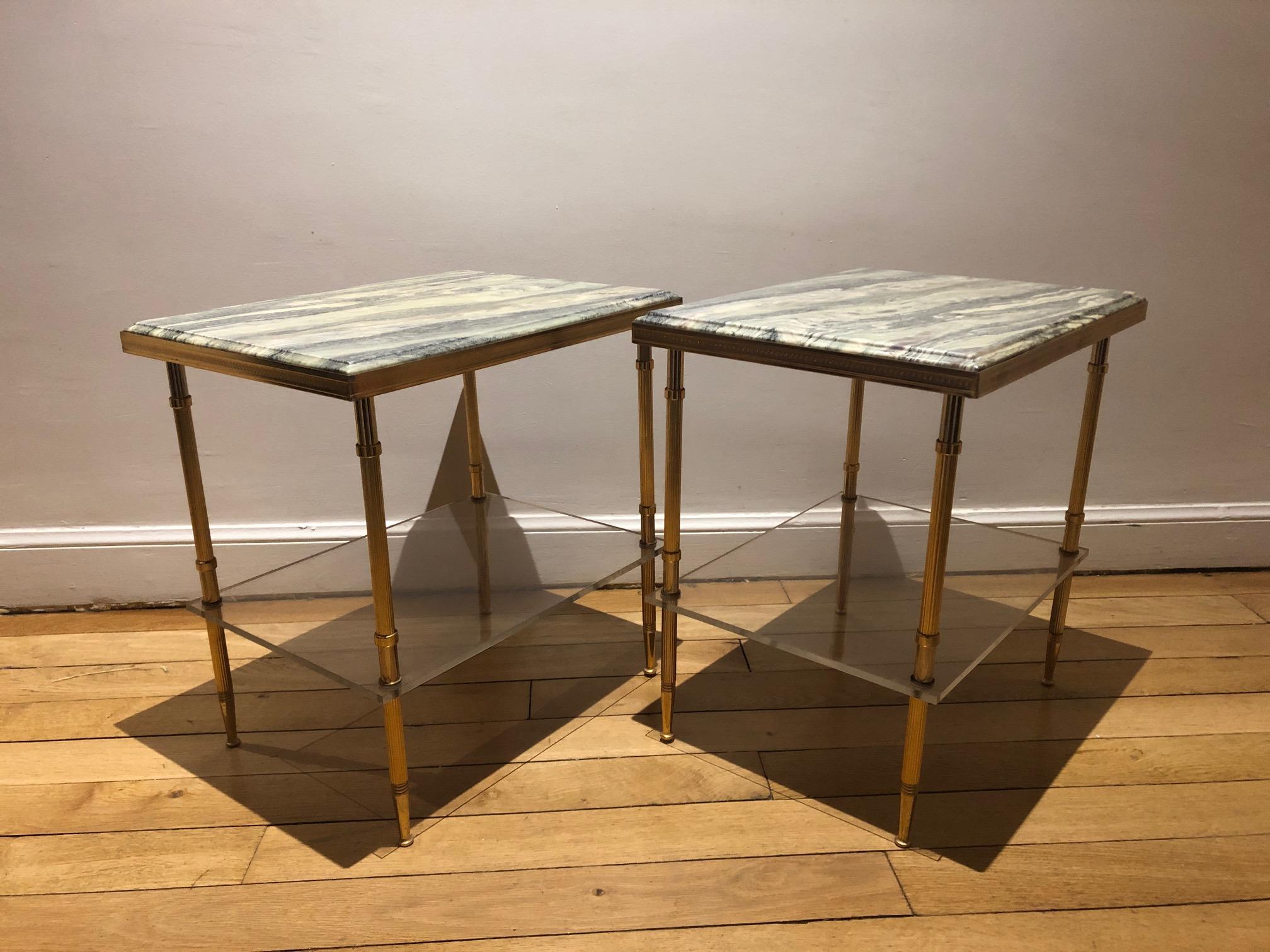 Two-tier neoclassical tables from the 1970s, top in varnish stone, shelf in plexiglass, structure in brass.