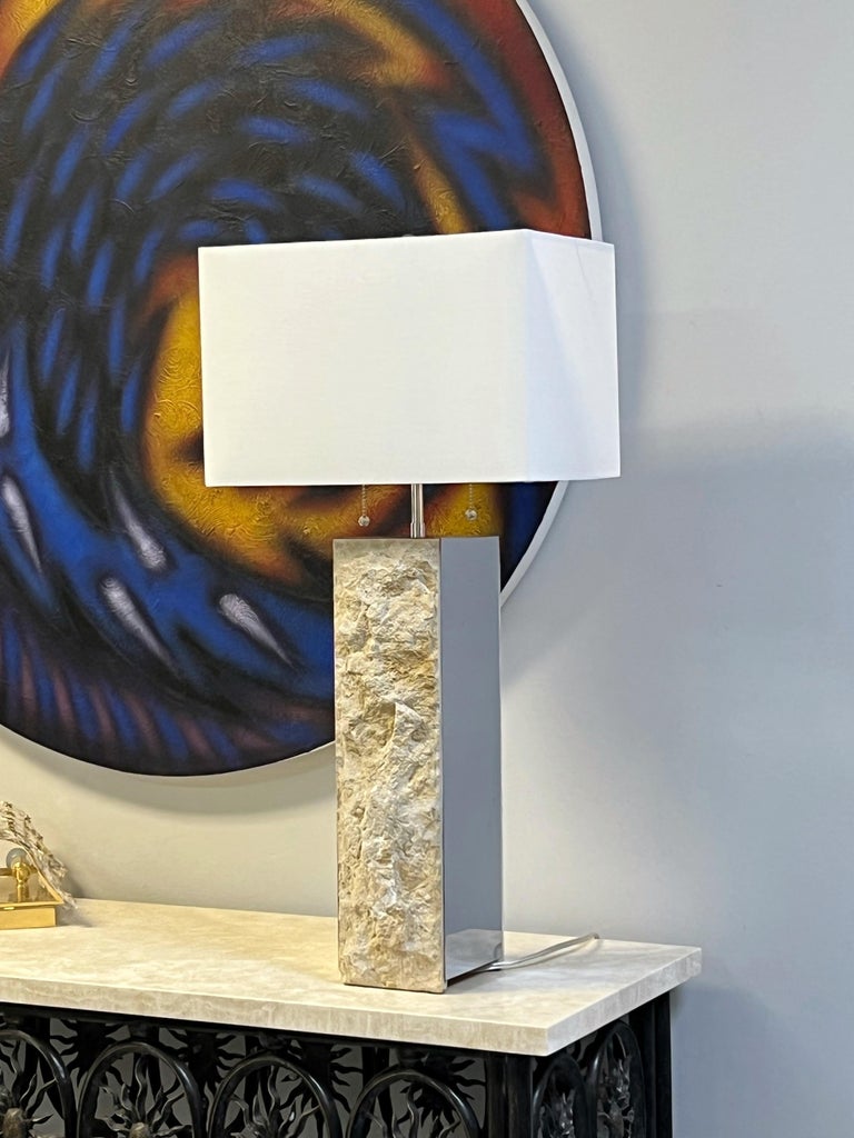 A pair of stone and chrome sculptural lamps by Laurel Lamp Co. Very interesting design created by the juxtaposition of the natural stone with the polished metal.
New wiring and cluster sockets.