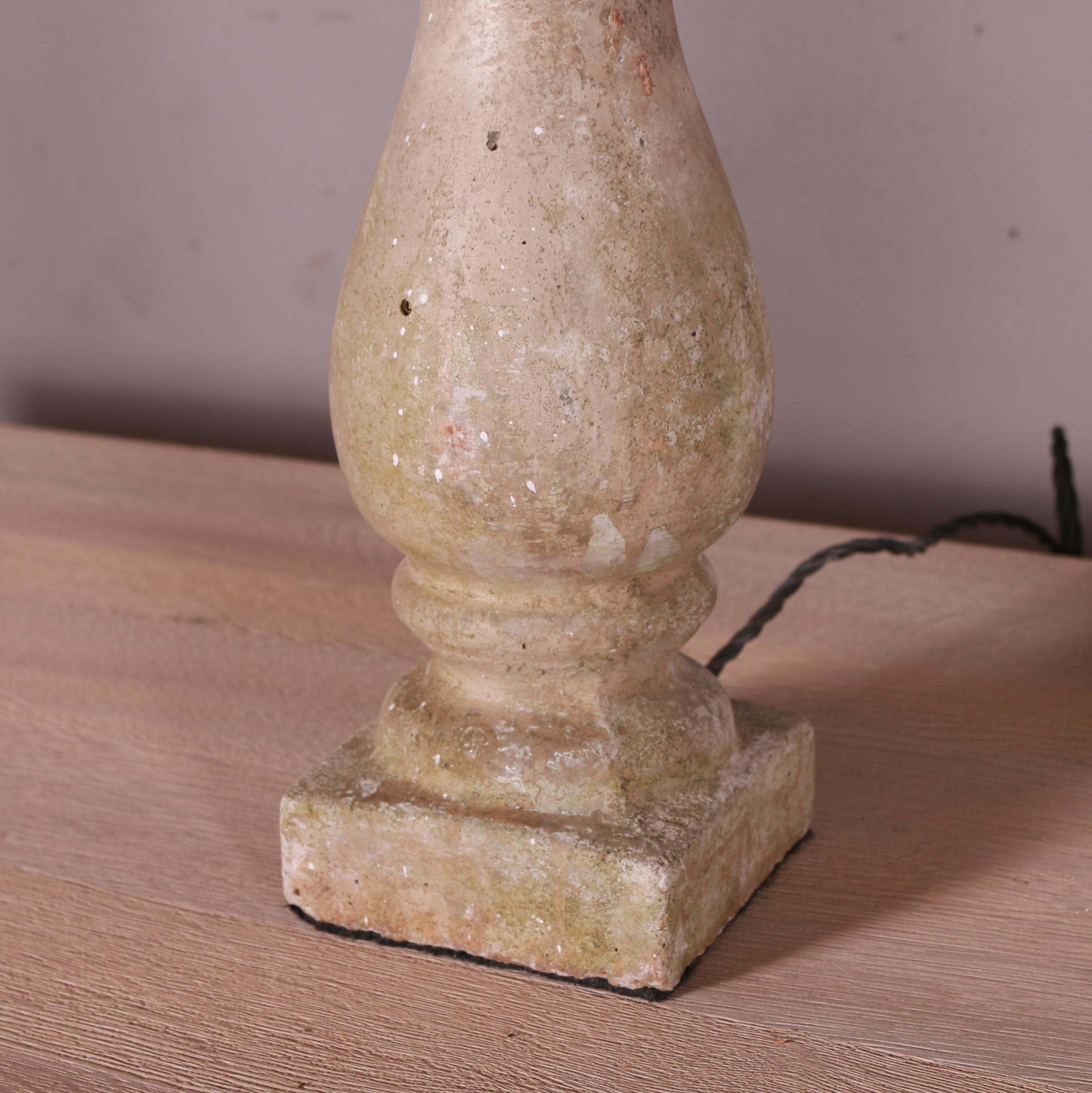 Pair of reconstituted stone balustrade table lamps topped with lead. These lamps have aged brass fittings and a braided cord with a UK plug head.

Height is to the bulb holder.

More are available if needed.

Dimensions
5.5 inches (14 cms)