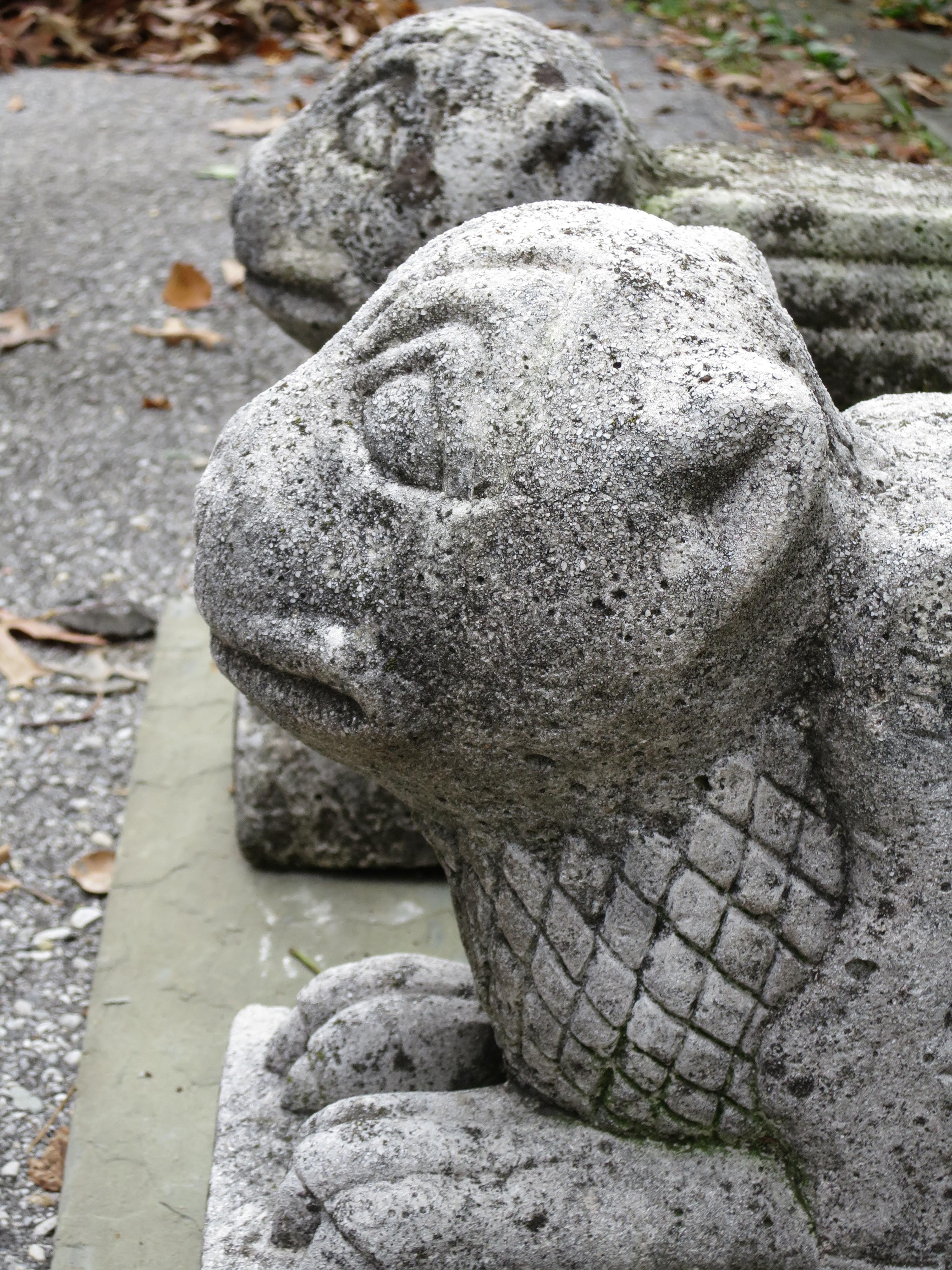 Pair of carved limestone griffins, bought in France.
Stylized faces, detailed carving of tails, feet, late 19th century.